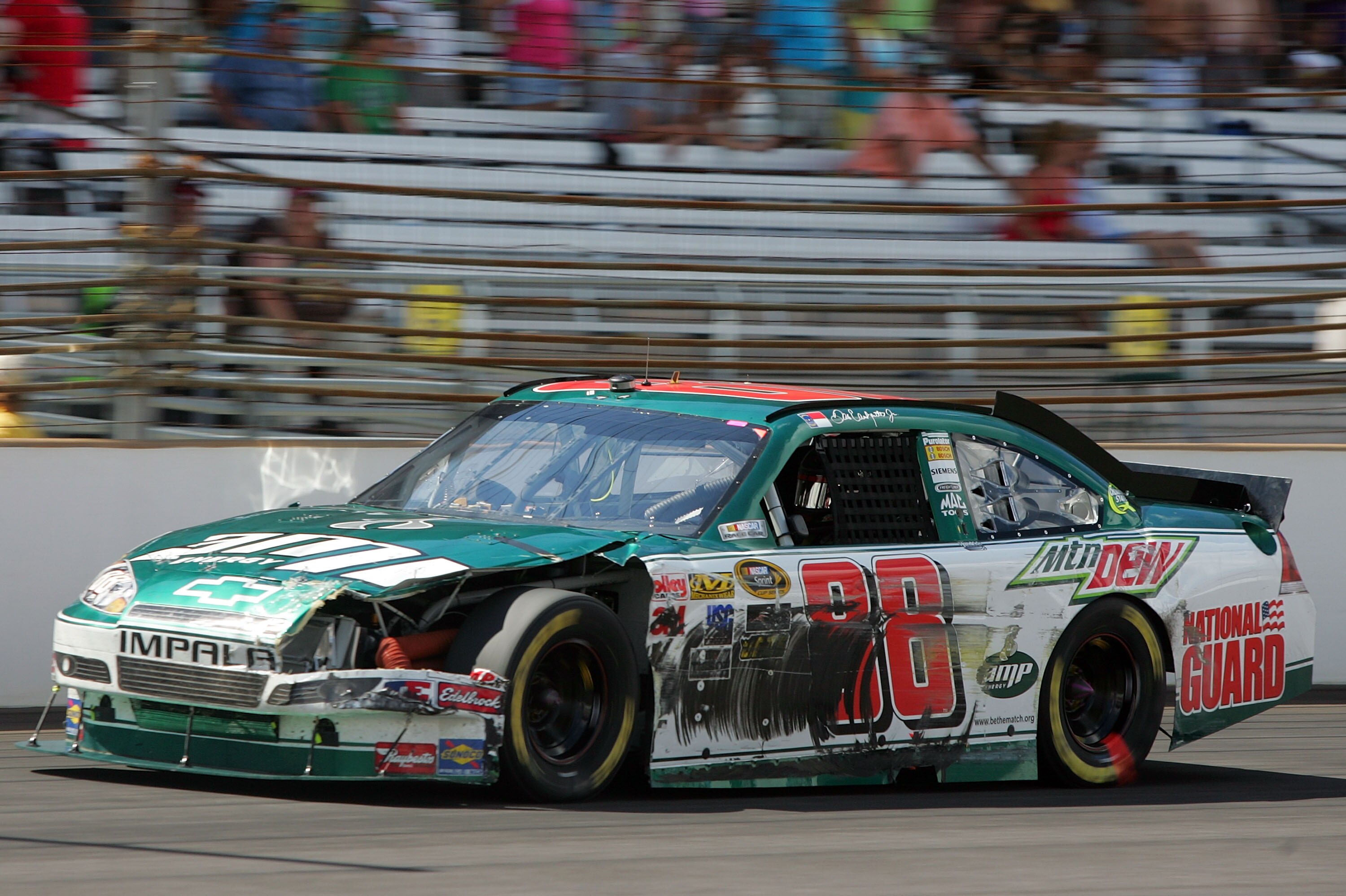 INDIANAPOLIS - JULY 25:  Dale Earnhardt Jr., driver of the #88 AMP Energy/National Guard Chevrolet, drives after suffering damage from a crash late in the race during the NASCAR Sprint Cup Series Brickyard 400 at Indianapolis Motor Speedway on July 25, 20