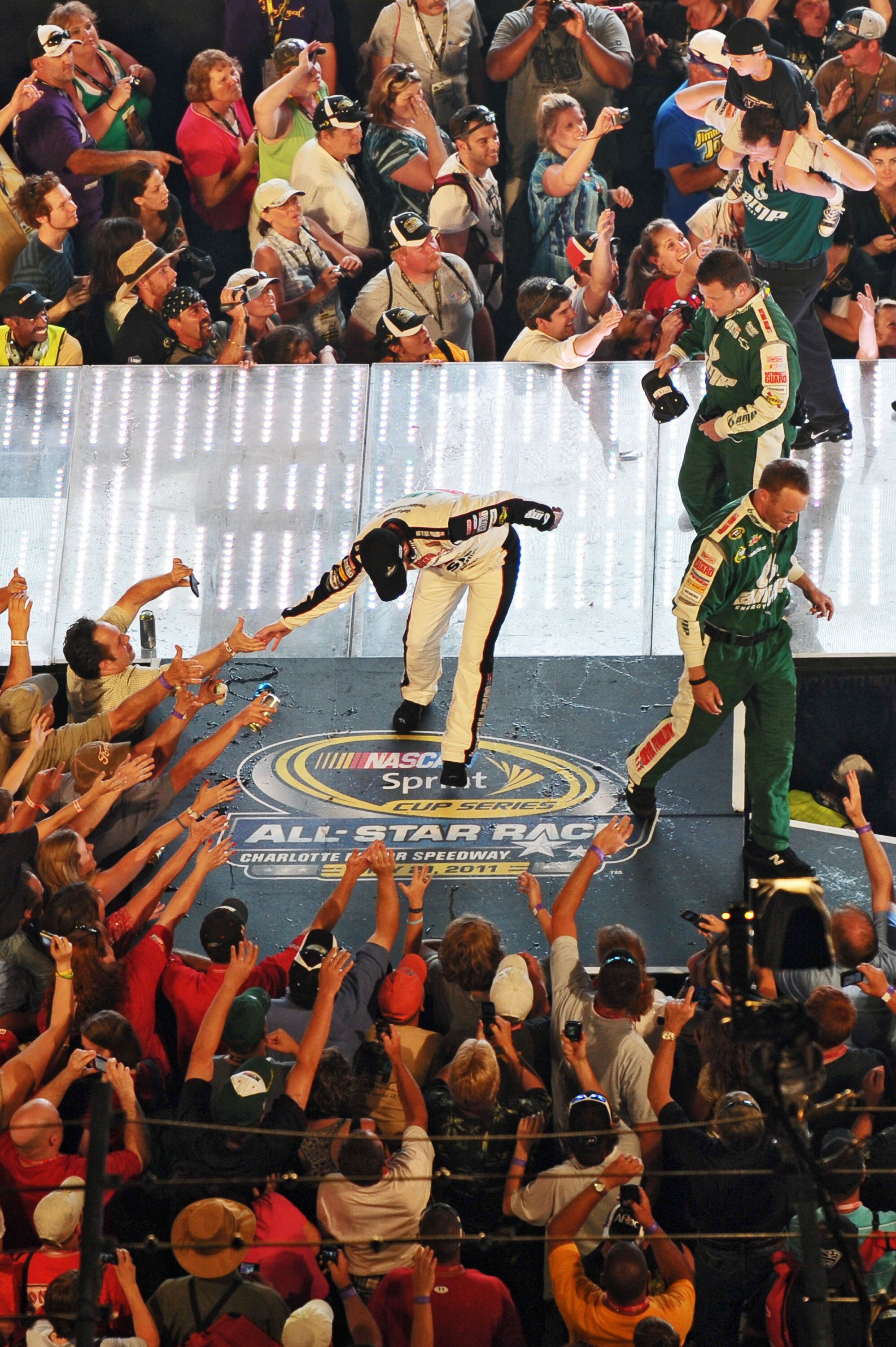 CHARLOTTE, NC - MAY 21: Dale Earnhardt Jr., driver of the #88 Dale Jr. Foundation/VH1 Save the Music/Amp Energy Sugar-Free/National Guard Chevrolet, greets the fans before the NASCAR Sprint All-Star Race at Charlotte Motor Speedway on May 21, 2011 in Char