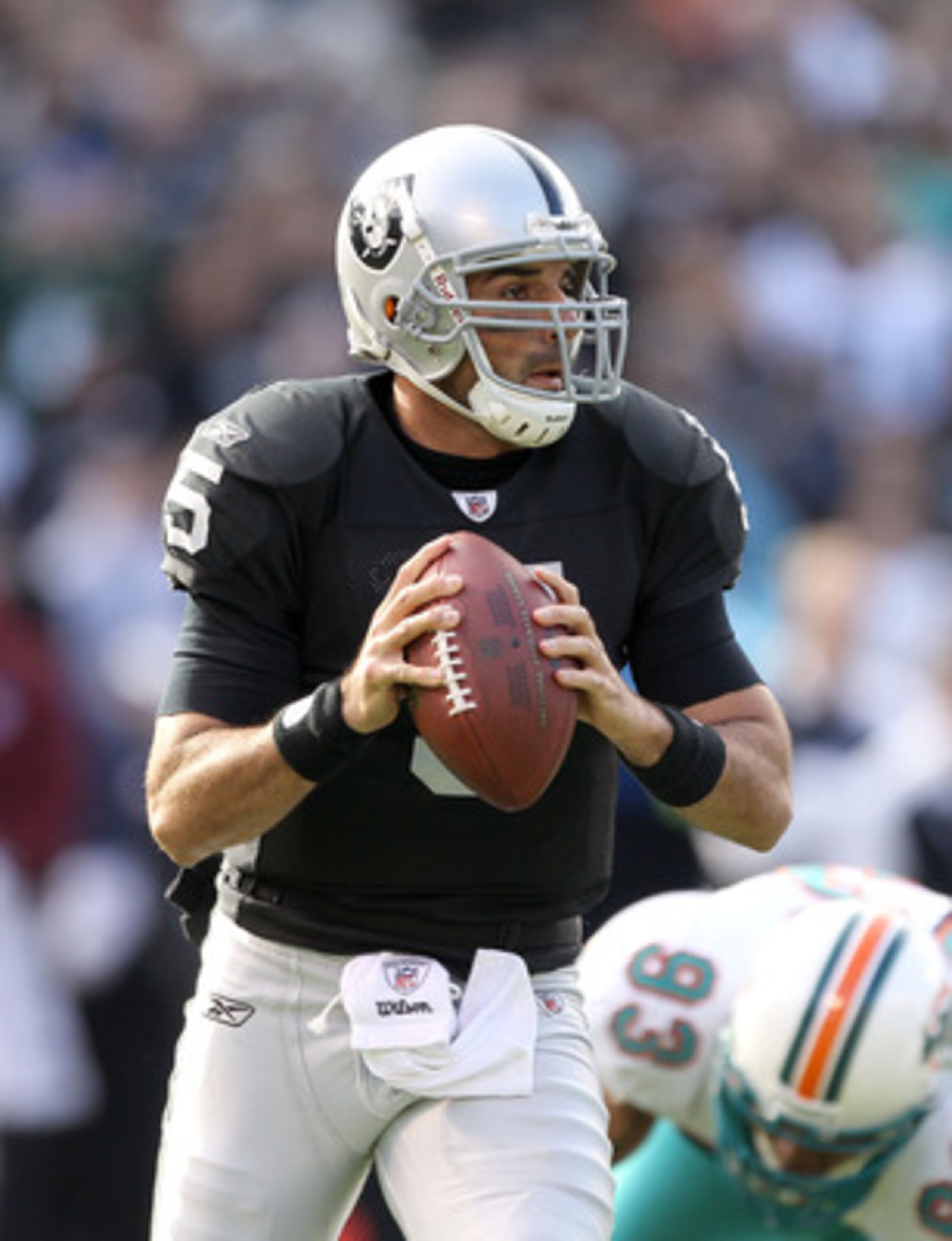 OAKLAND, CA - NOVEMBER 28:  Bruce Gradkowski #5 of the Oakland Raiders in action against the Miami Dolphins at Oakland-Alameda County Coliseum on November 28, 2010 in Oakland, California.  (Photo by Ezra Shaw/Getty Images)