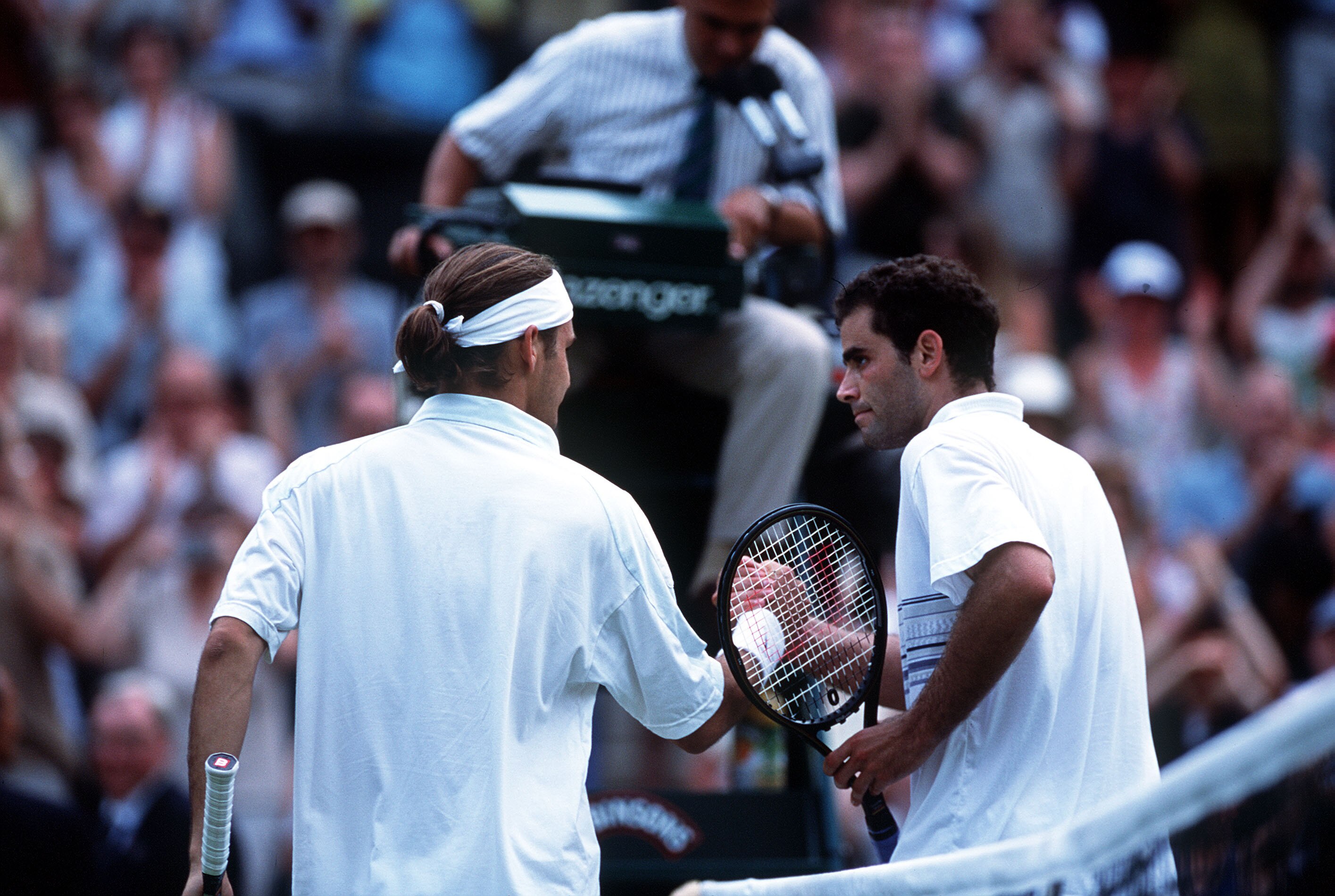 2 Jul 2001:  Pete Sampras of the USA congratulates Roger Federer of Switzerland following his victory during the men's fourth round of The All England Lawn Tennis Championship at Wimbledon, London.  Mandatory Credit: Clive Brunskill/ALLSPORT