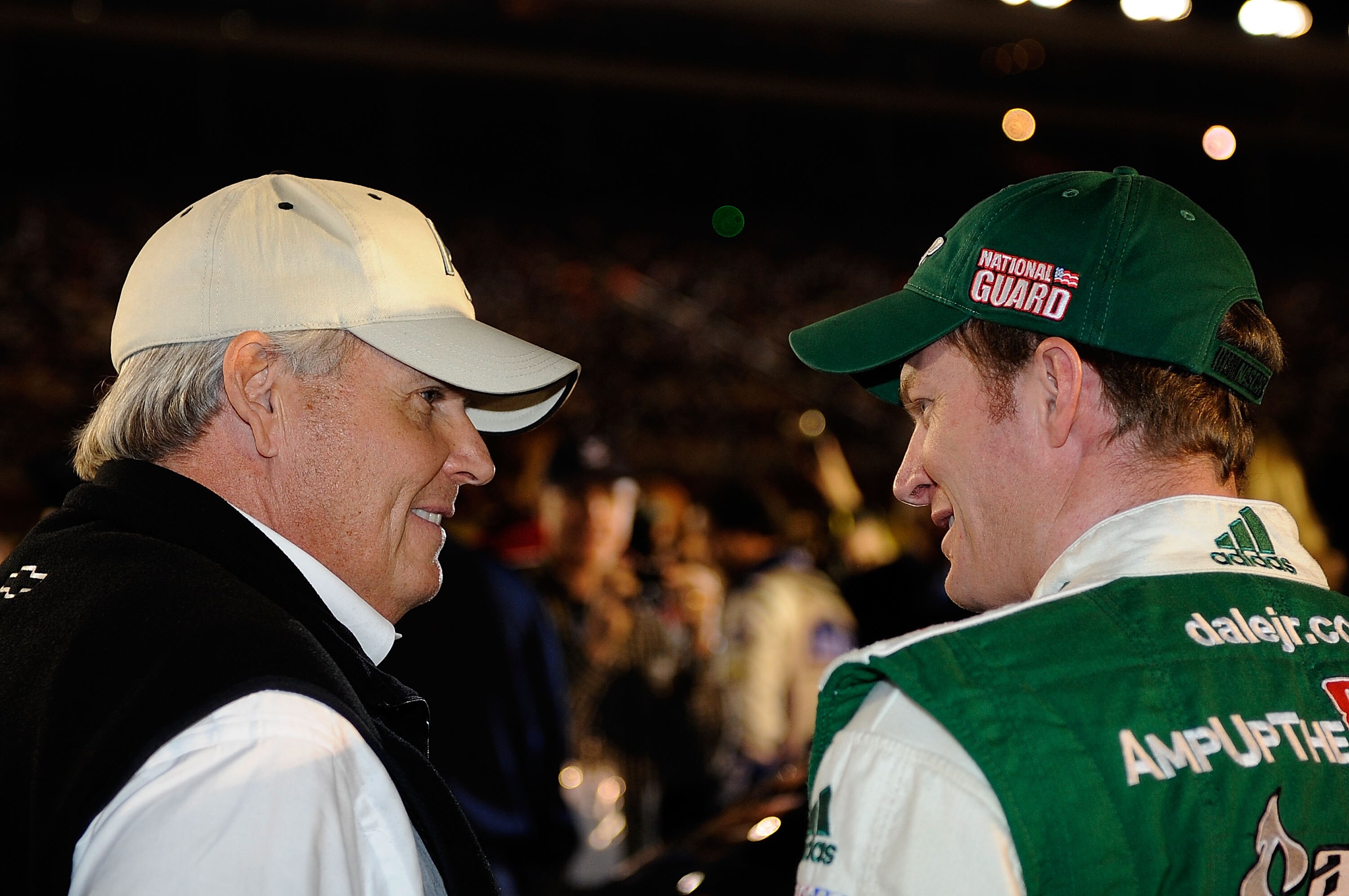 CONCORD, NC - OCTOBER 16:  Car Owner Rick Hendrick (L) talks with Dale Earnhardt Jr., driver of the #88 AMP Energy/National Guard Chevrolet, on the grid prior to the NASCAR Sprint Cup Series Bank of America 500 at Charlotte Motor Speedway on October 16, 2