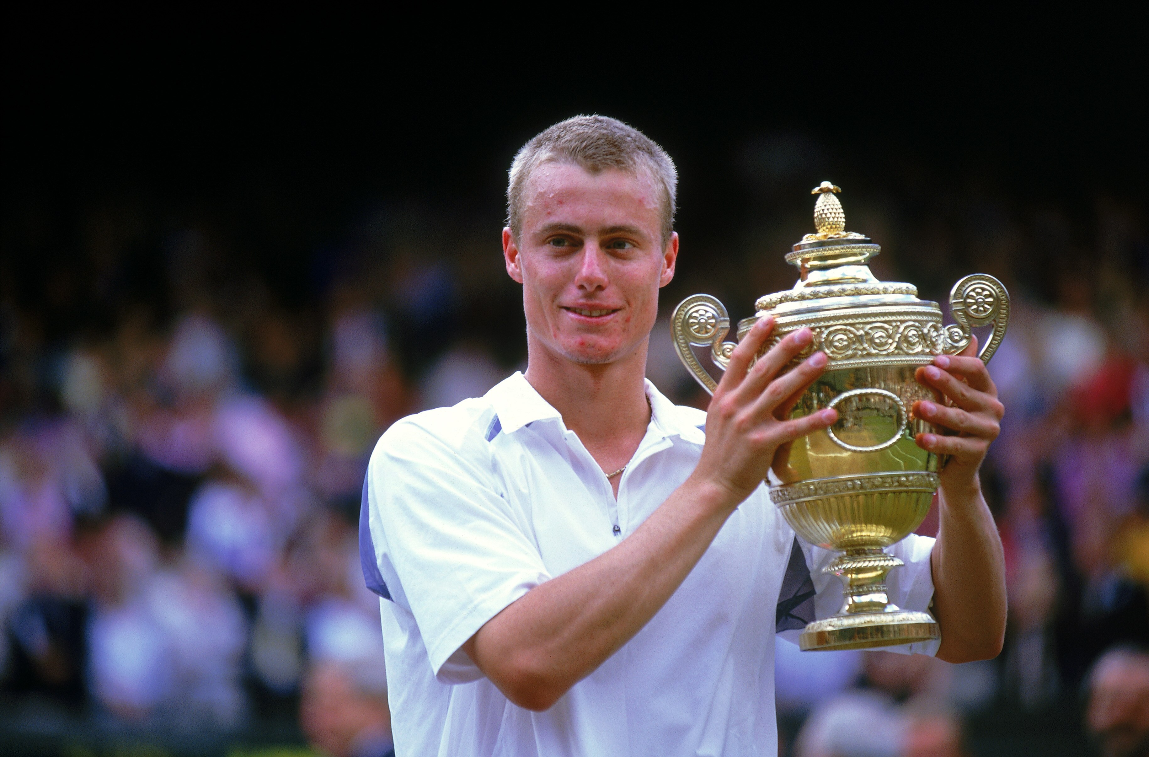 WIMBLEDON - 7 JULY:  Lleyton Hewitt of Australia lifts the trophy after victory over David Nalbandian of Argentina in the Men's Singles Final of the Lawn Tennis Championships at the All England Club in Wimbledon, England. Hewitt won 6-1. 6-3, 6-2. (photo