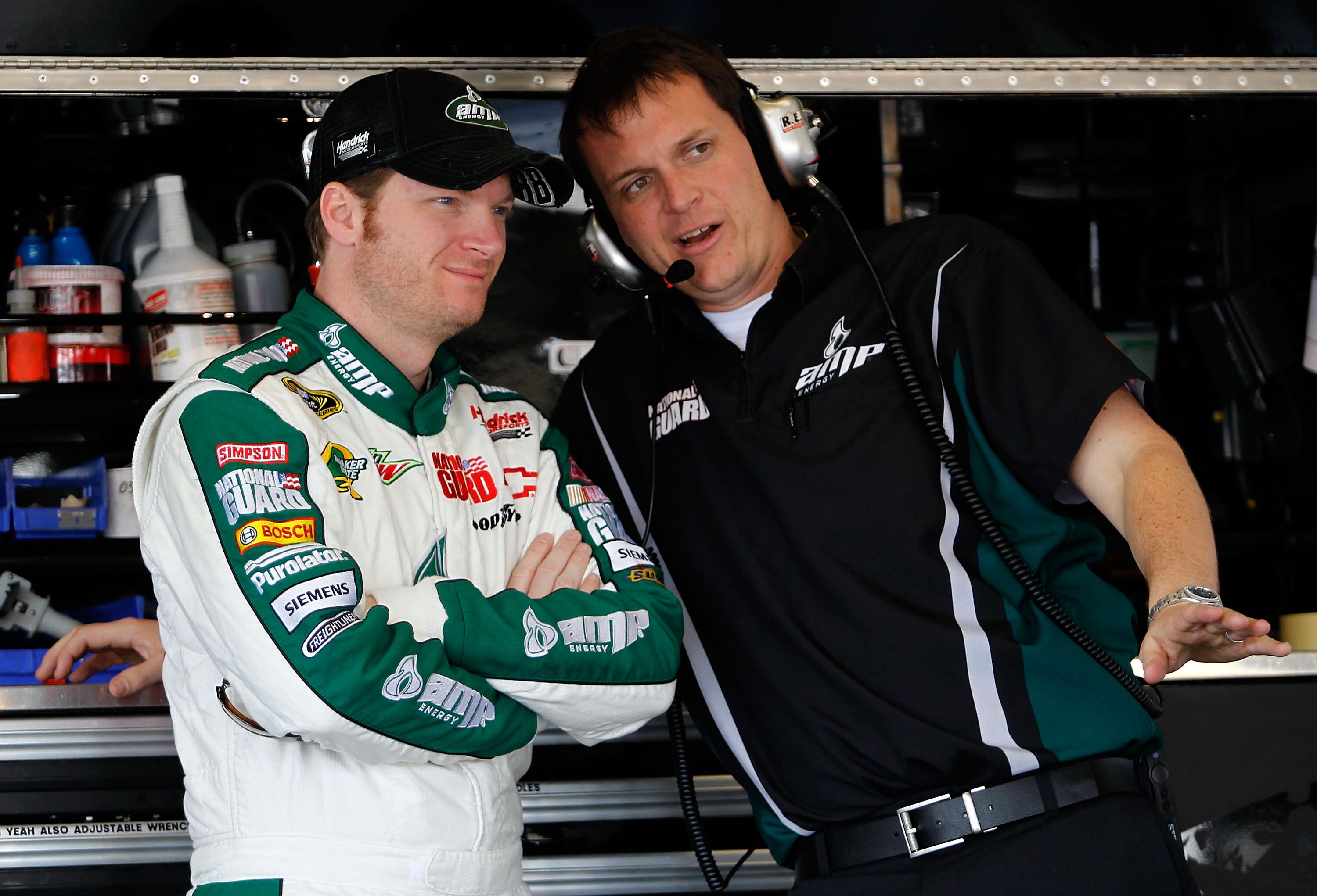 DAYTONA BEACH, FL - FEBRUARY 18:  Dale Earnhardt Jr., driver of the #88 National Guard/AMP Energy Chevrolet, speaks with his crew chief Steve Letarte during practice for the NASCAR Sprint Cup Series Daytona 500 at Daytona International Speedway on Februar