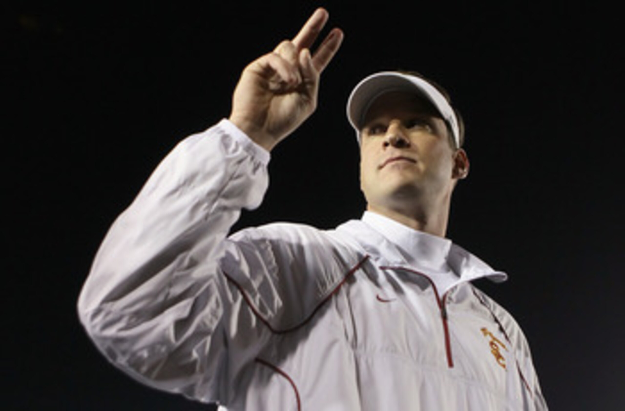 PASADENA, CA - DECEMBER 04:  USC Trojans head coach Lane Kiffin celebrates following his teams victory over the UCLA Bruins at the Rose Bowl on December 4, 2010 in Pasadena, California.  USC defeated UCLA 28-14.  (Photo by Jeff Gross/Getty Images)