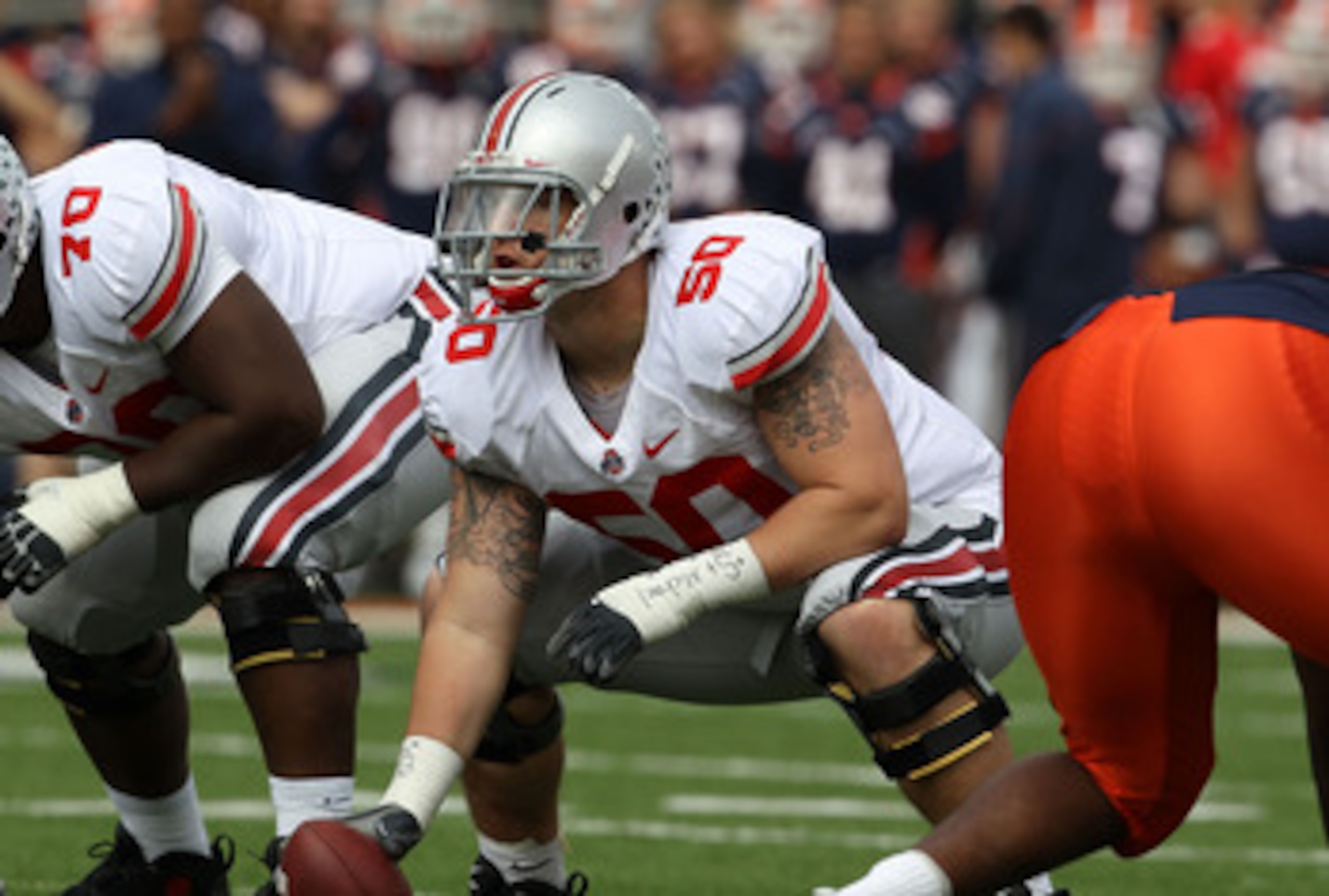 CHAMPAIGN, IL - OCTOBER 02: Mike Brewster #50 of the Ohio State Buckeyes waits to snap the ball against the Illinois Fighting Illini at Memorial Stadium on October 2, 2010 in Champaign, Illinois. Ohio State defeated Illinois 24-13.  (Photo by Jonathan Dan