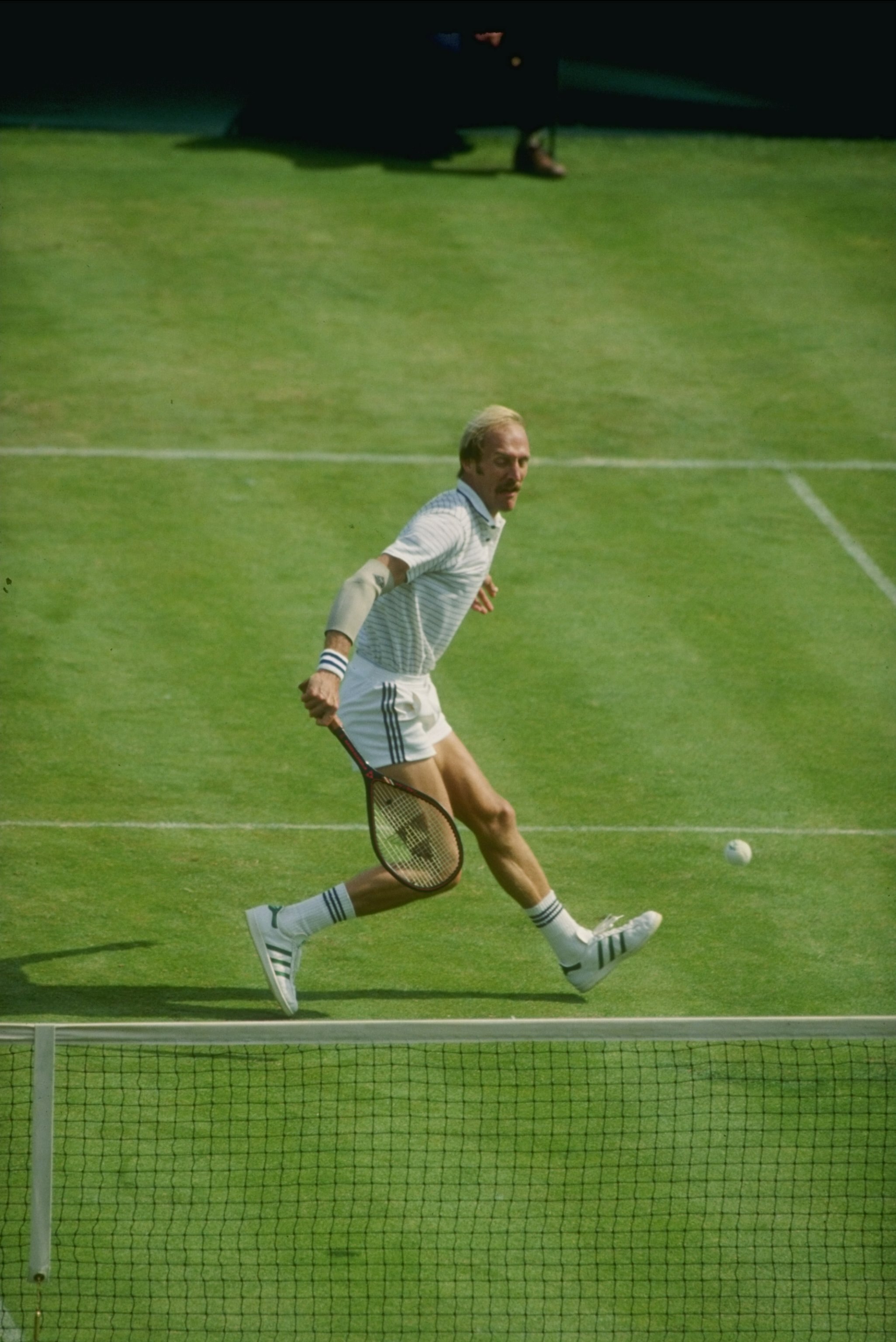 1980:  Stan Smith in action during a match at Wimbledon in London, England. Mandatory Credit: Tony Duffy  /Allsport