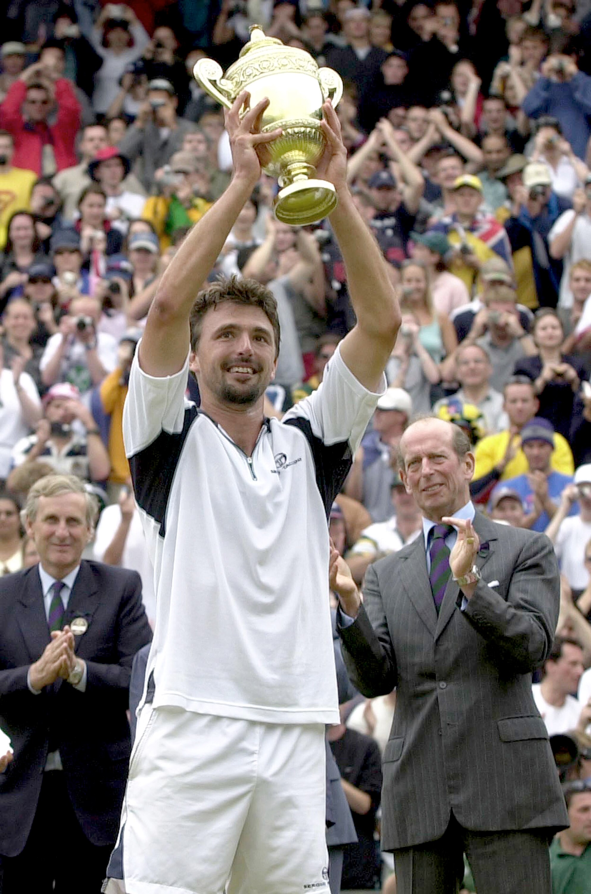 391610 04: Goran Ivanisevic of Croatia raises the Wimbledon trophy after defeating Patrick Rafter of Australia during the Men''s Finals of The All England Lawn Tennis Championship July 9, 2001 at Wimbledon in London, England. Wildcard Ivanisevic upset the