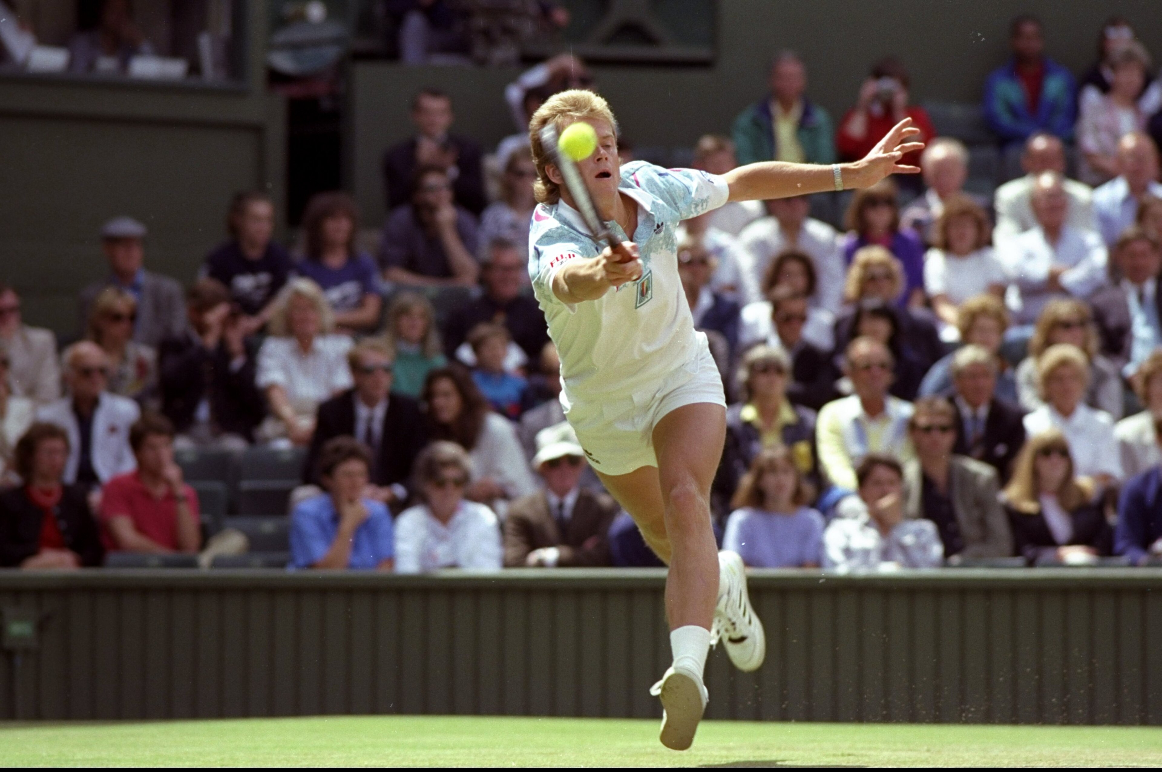Jun-Jul 1990:  Stefan Edberg of Sweden reaches to play a forehand return during the Lawn Tennis Championships at Wimbledon in London. \ Mandatory Credit: Russell  Cheyne/Allsport