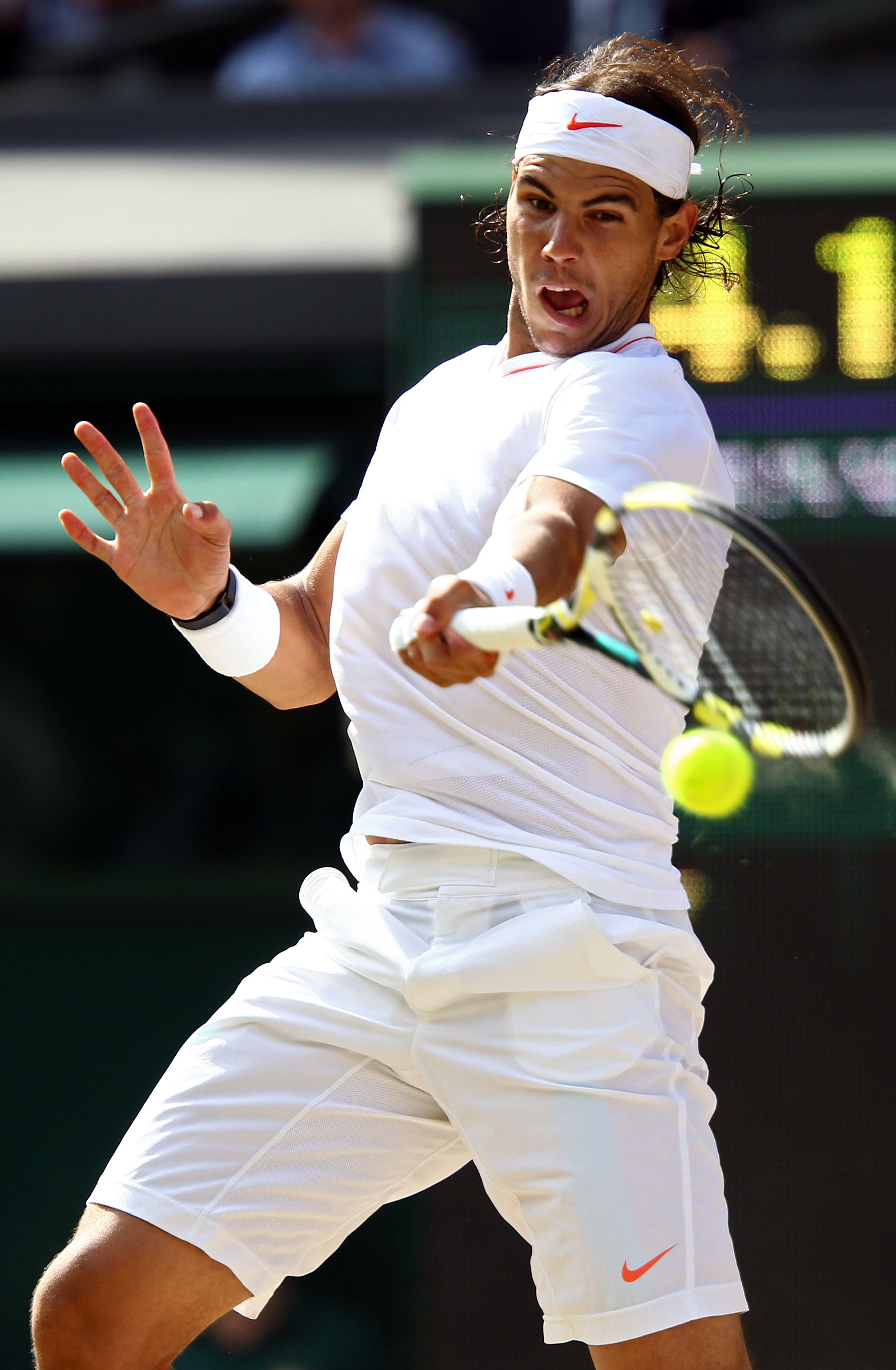 LONDON, ENGLAND - JULY 04:  Rafael Nadal of Spain plays a shot during the Men's Singles Final match against Tomas Berdych of Czech Republic on Day Thirteen of the Wimbledon Lawn Tennis Championships at the All England Lawn Tennis and Croquet Club on July