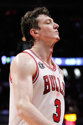 CHICAGO, IL - MAY 18:  Blood drips from the neck of Omer Asik #3 of the Chicago Bulls after he drew contact against the Miami Heat in Game Two of the Eastern Conference Finals during the 2011 NBA Playoffs on May 18, 2011 at the United Center in Chicago, I