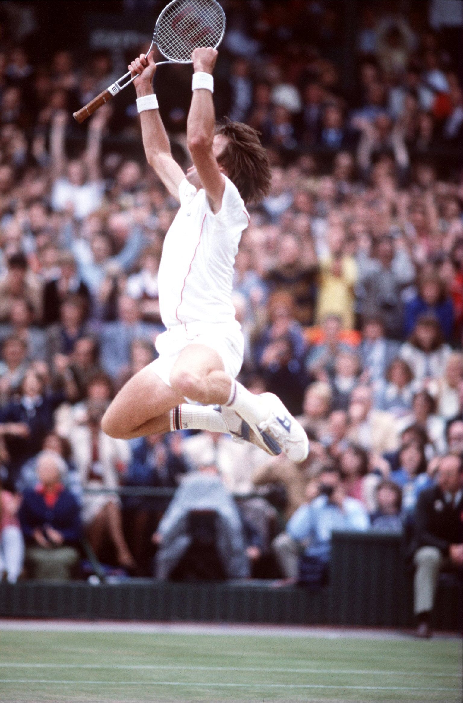 JUL 1982:  A PICTURE SHOWING JIMMY CONNORS OF THE UNITED STATES AS HE JUMPS FOR JOY AFTER BEATING MCENROE TO WIN HIS SECOND WIMBLEDON TENNIS CHAMPIONSHIP Mandatory Credit: Steve Powell/ALLSPORT