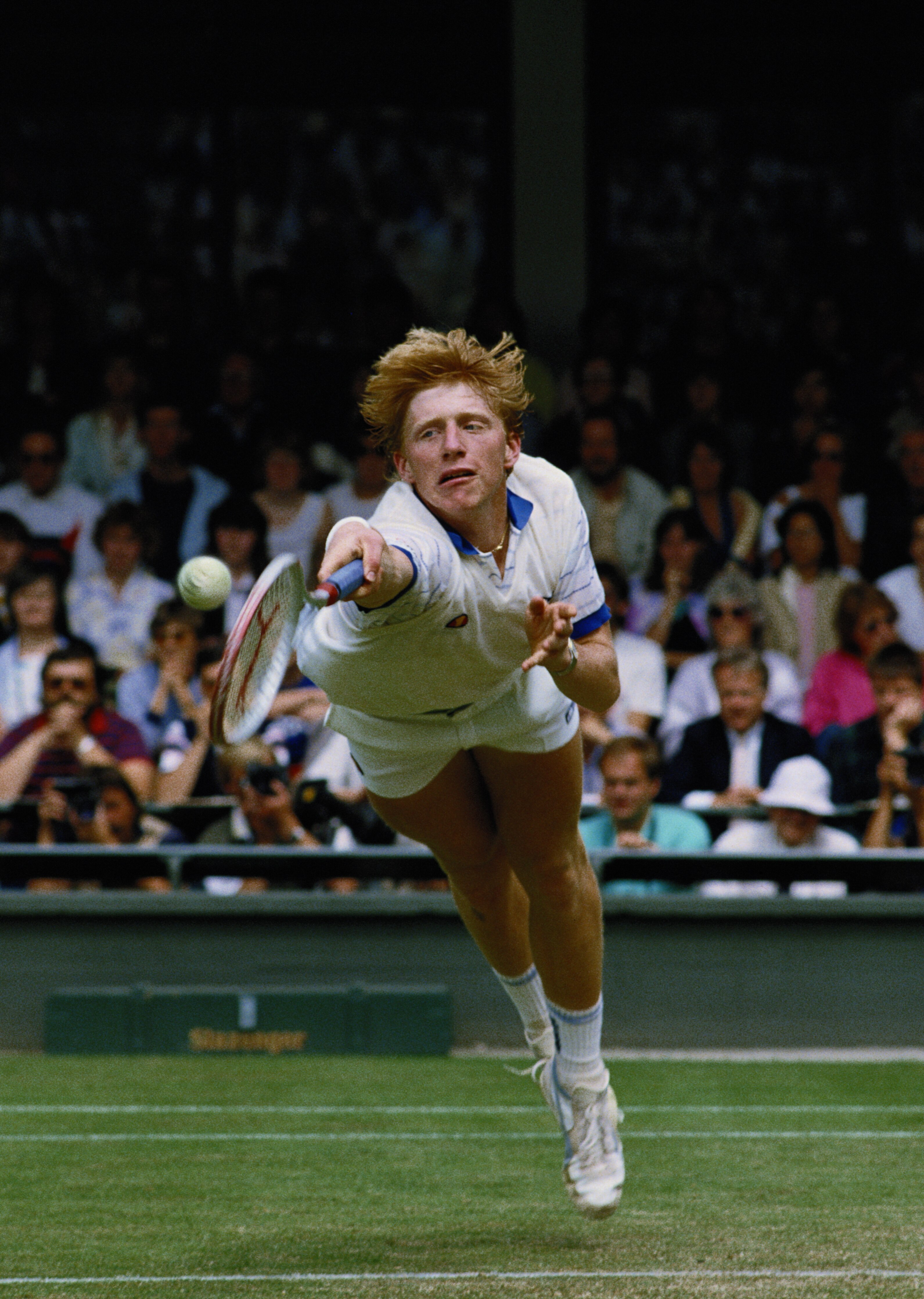 Boris Becker of Germany stretches to make a diving backhand return from  Anders Jarryd during the Men's singles semi final of the Wimbledon Lawn Tennis Championship on 5th July 1985 at the All England Lawn Tennis and Croquet Club in Wimbledon in London, E