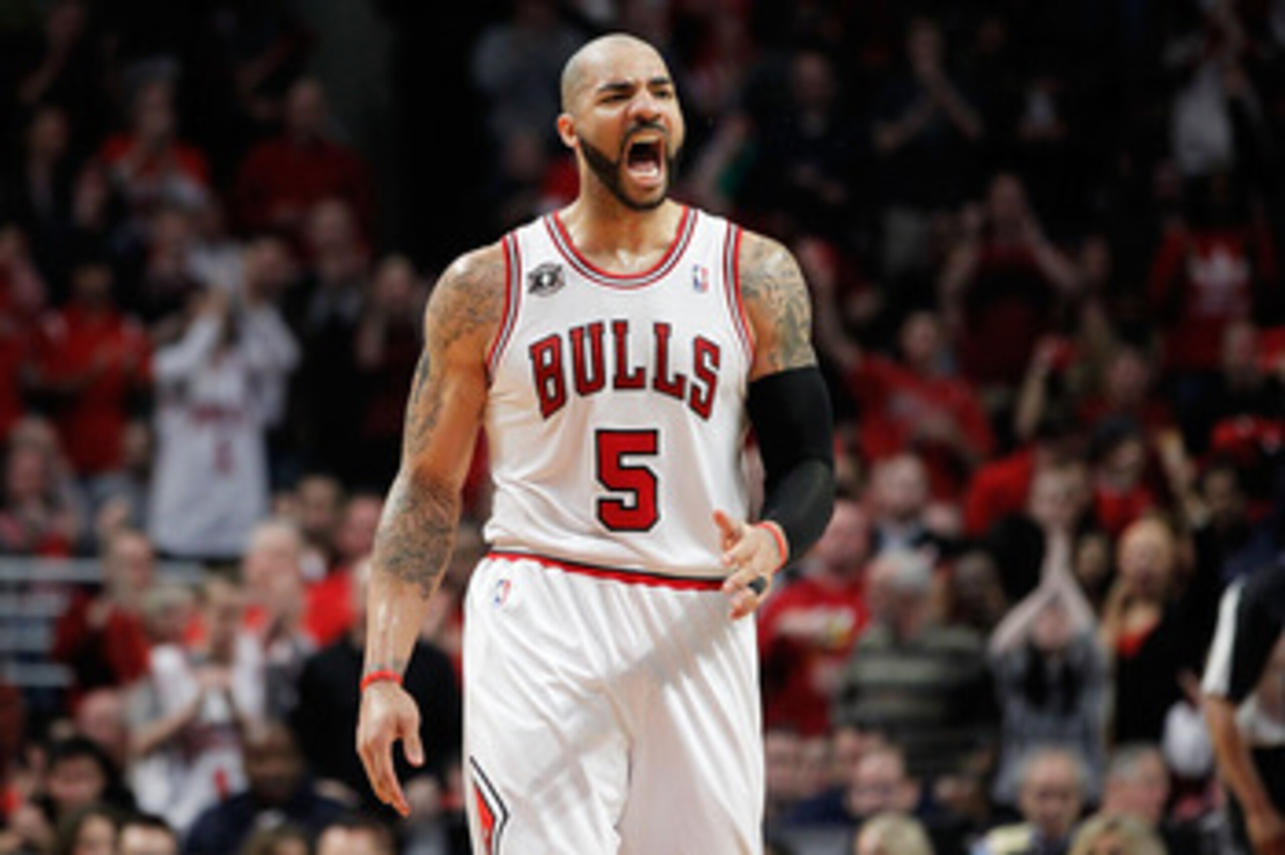 CHICAGO, IL - MAY 15:  Carlos Boozer #5 of the Chicago Bulls reacts against the Miami Heat in Game One of the Eastern Conference Finals during the 2011 NBA Playoffs on May 15, 2011 at the United Center in Chicago, Illinois. NOTE TO USER: User expressly ac