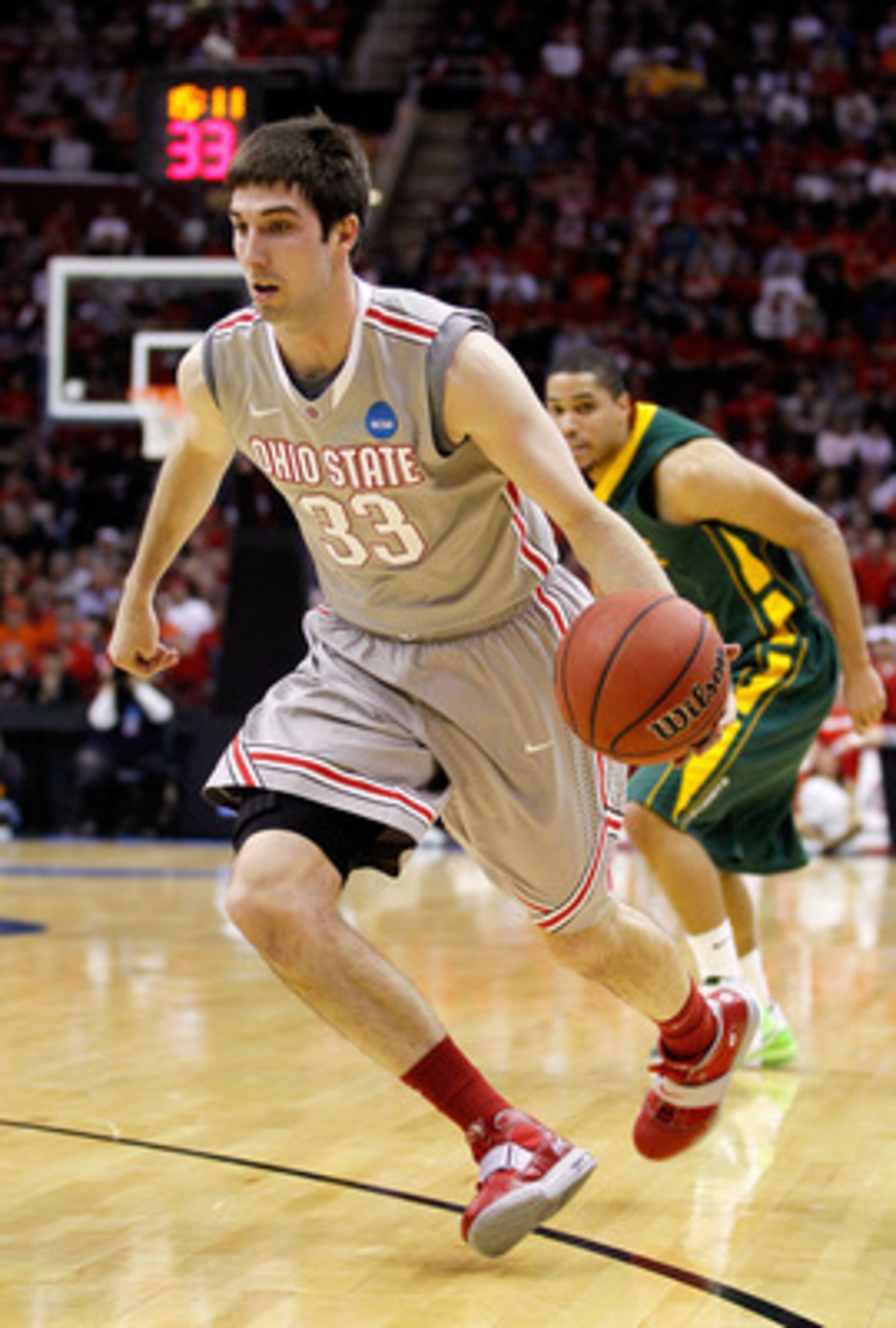 CLEVELAND, OH - MARCH 20: Jon Diebler #33 of the Ohio HState Buckeyes handles the ball against the George Mason Patriots during the third of the 2011 NCAA men's basketball tournament at Quicken Loans Arena on March 20, 2011 in Cleveland, Ohio.  (Photo by