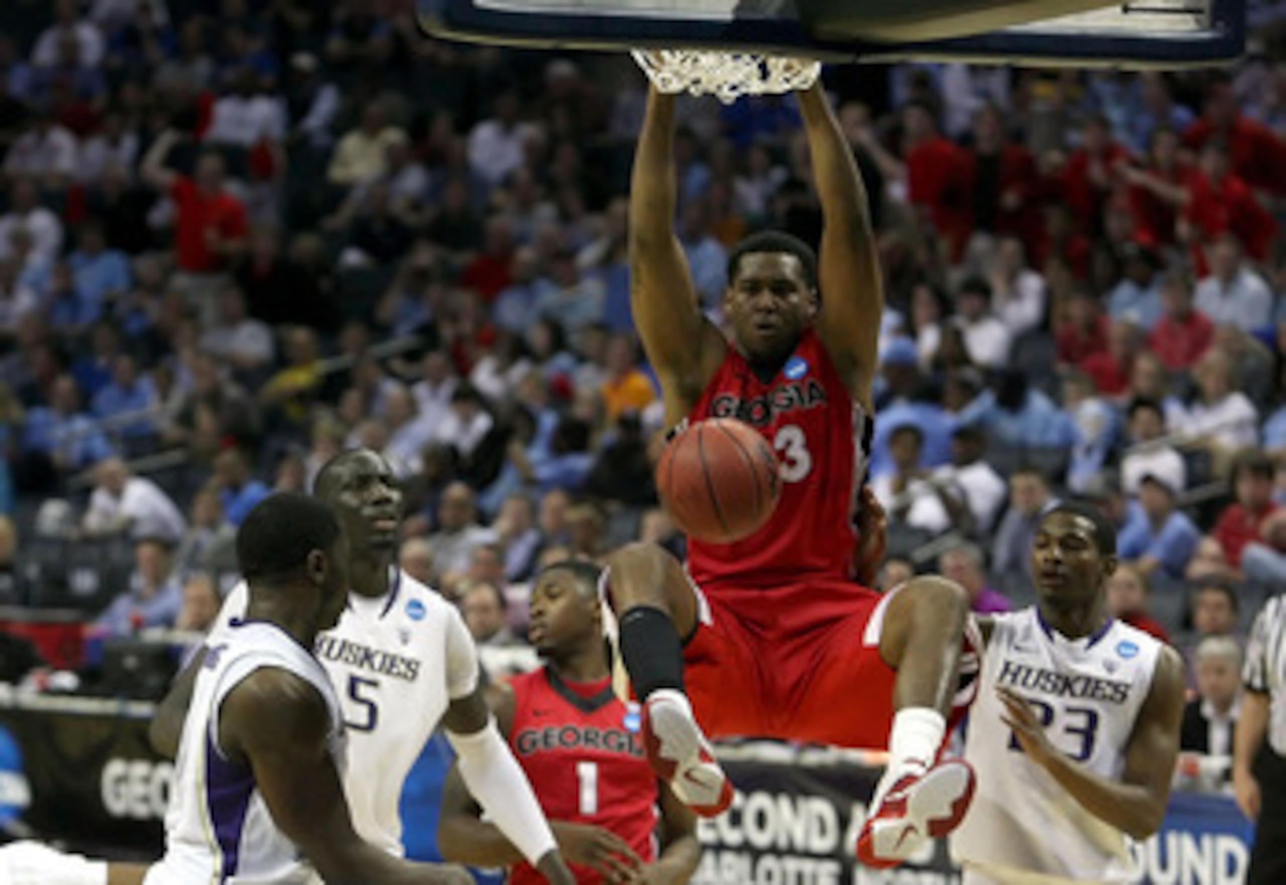 CHARLOTTE, NC - MARCH 18:  Trey Thompkins #33 of the Georgia Bulldogs dunks the ball while taking on the Washington Huskies during the second round of the 2011 NCAA men's basketball tournament at Time Warner Cable Arena on March 18, 2011 in Charlotte, Nor