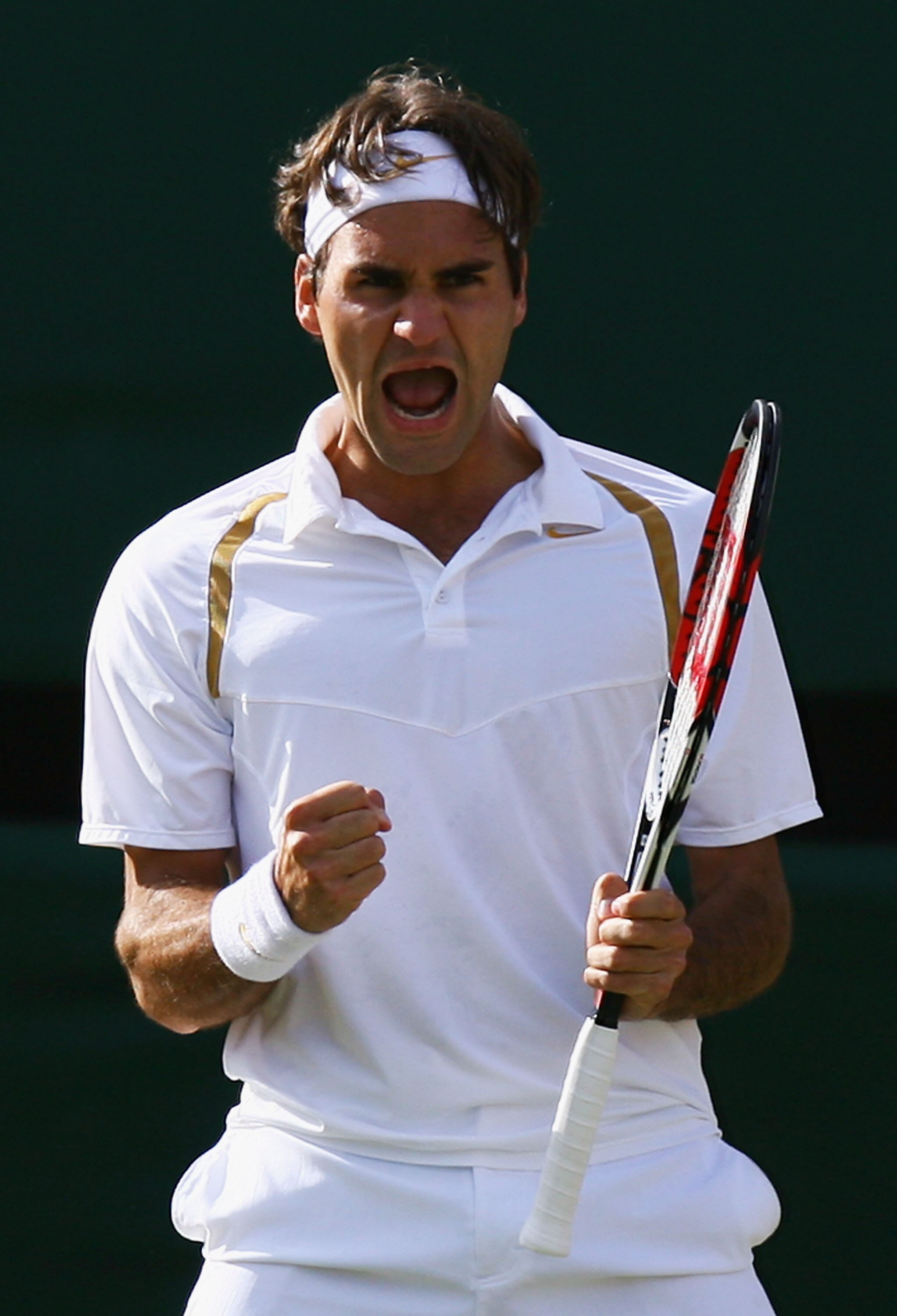 LONDON - JULY 08:  Roger Federer of Switzerland reacts during the Men's Singles final match against Rafael Nadal of Spain during day thirteen of the Wimbledon Lawn Tennis Championships at the All England Lawn Tennis and Croquet Club on July 8, 2007 in Lon