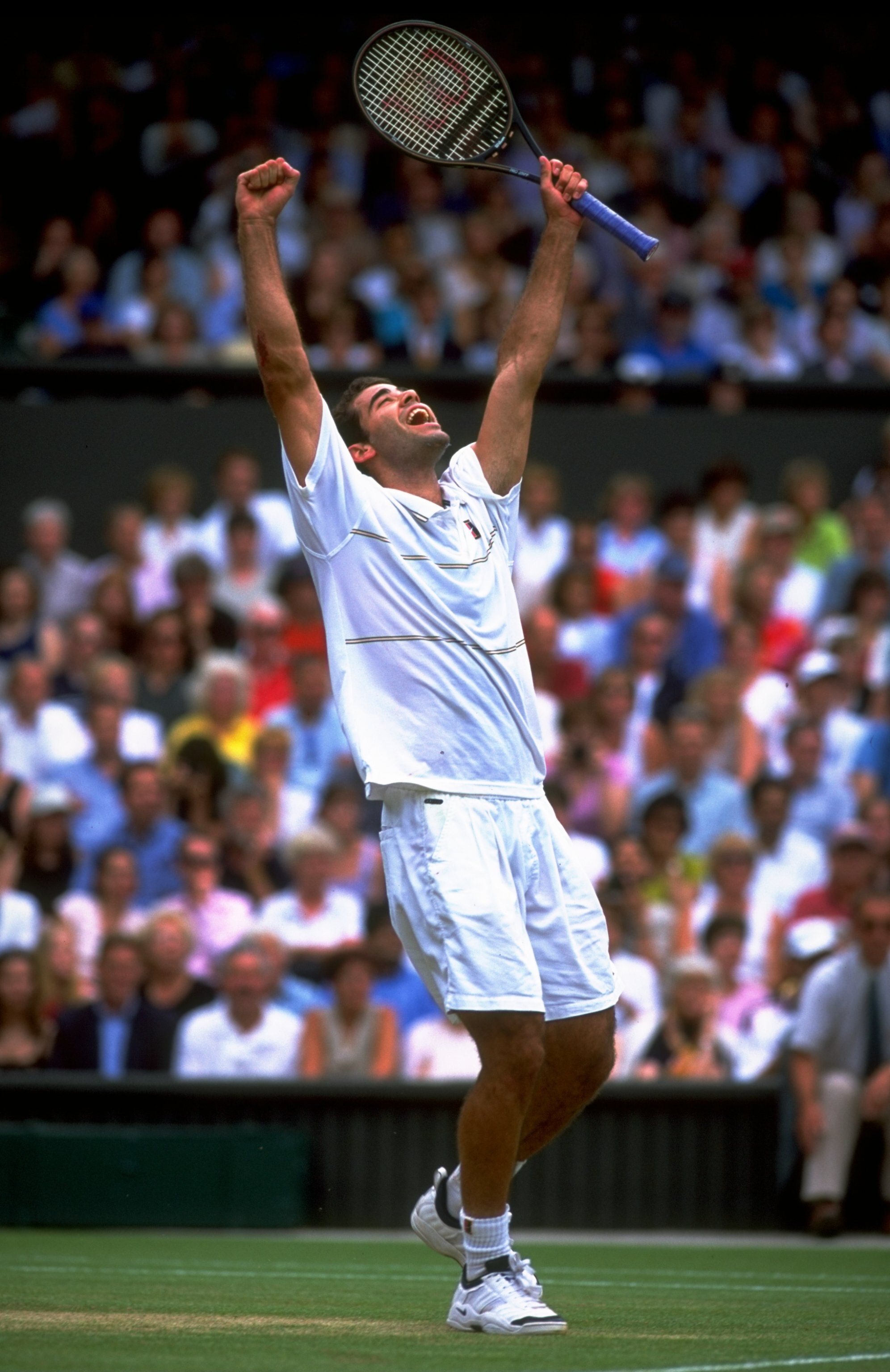 4 Jul 1999:  Pete Sampras of the United States celebrates victory after winning the Men's Singles Championship Final match against Andre Agassi also of the United States played at the All England Club in Wimbledon, England.  The match finished in a compre