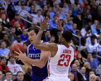 NEWARK, NJ - MARCH 25:  Josh Harrellson #55 of the Kentucky Wildcats in action against David Lighty #23 of the Ohio State Buckeyes during the east regional semifinal of the 2011 NCAA Men's Basketball Tournament at the Prudential Center on March 25, 2011 i