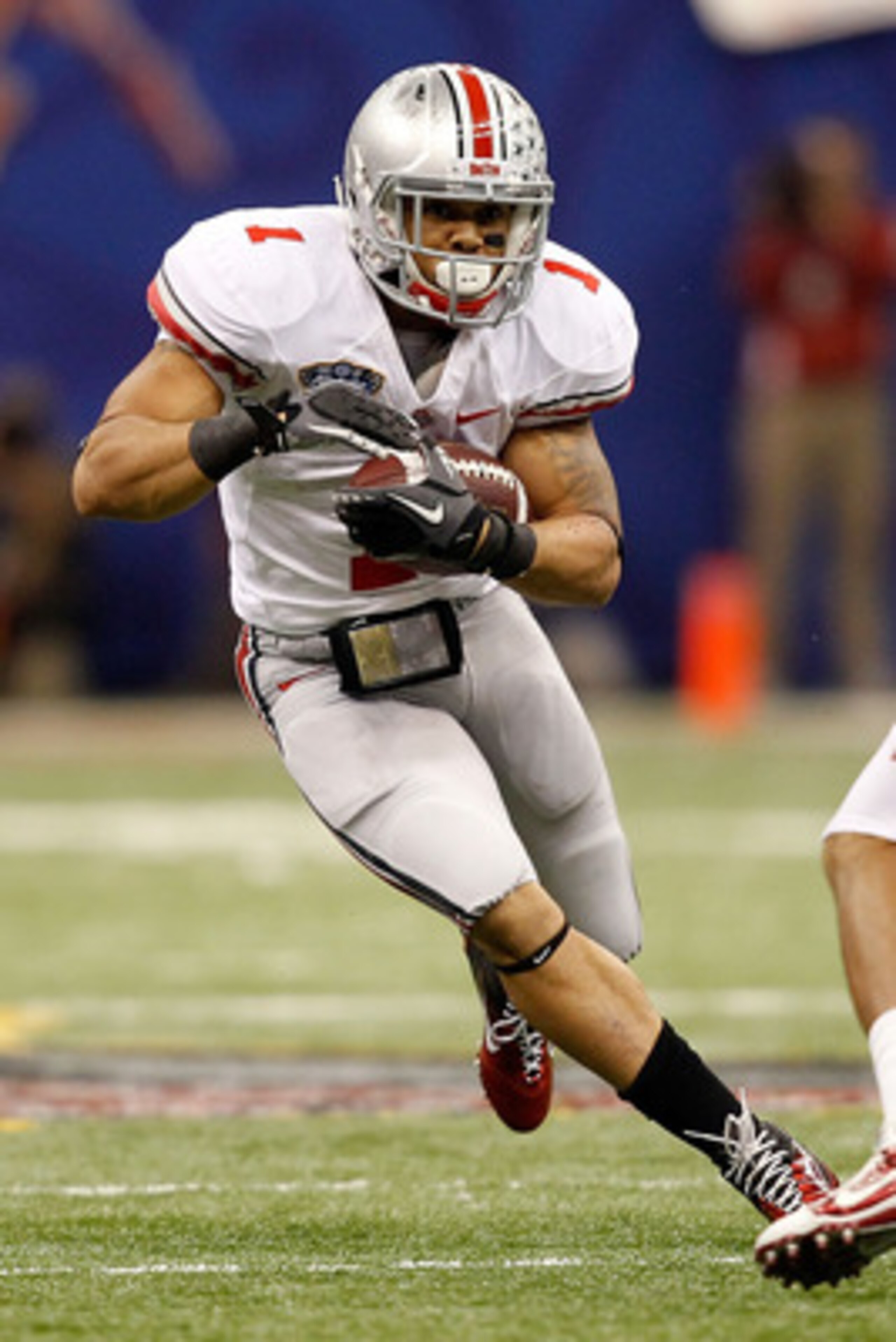 NEW ORLEANS, LA - JANUARY 04: Dan Herron #1 of the Ohio State Buckeyes runs the ball against the Arkansas Razorbacks during the Allstate Sugar Bowl at the Louisiana Superdome on January 4, 2011 in New Orleans, Louisiana. (Photo by Matthew Stockman/Getty NEW ORLEANS, LA - JANUARY 04: Dan Herron #1 of the Ohio State Buckeyes runs the ball against the Arkansas Razorbacks during the Allstate Sugar Bowl at the Louisiana Superdome on January 4, 2011 in New Orleans, Louisiana. (Photo by Matthew Stockman/Getty