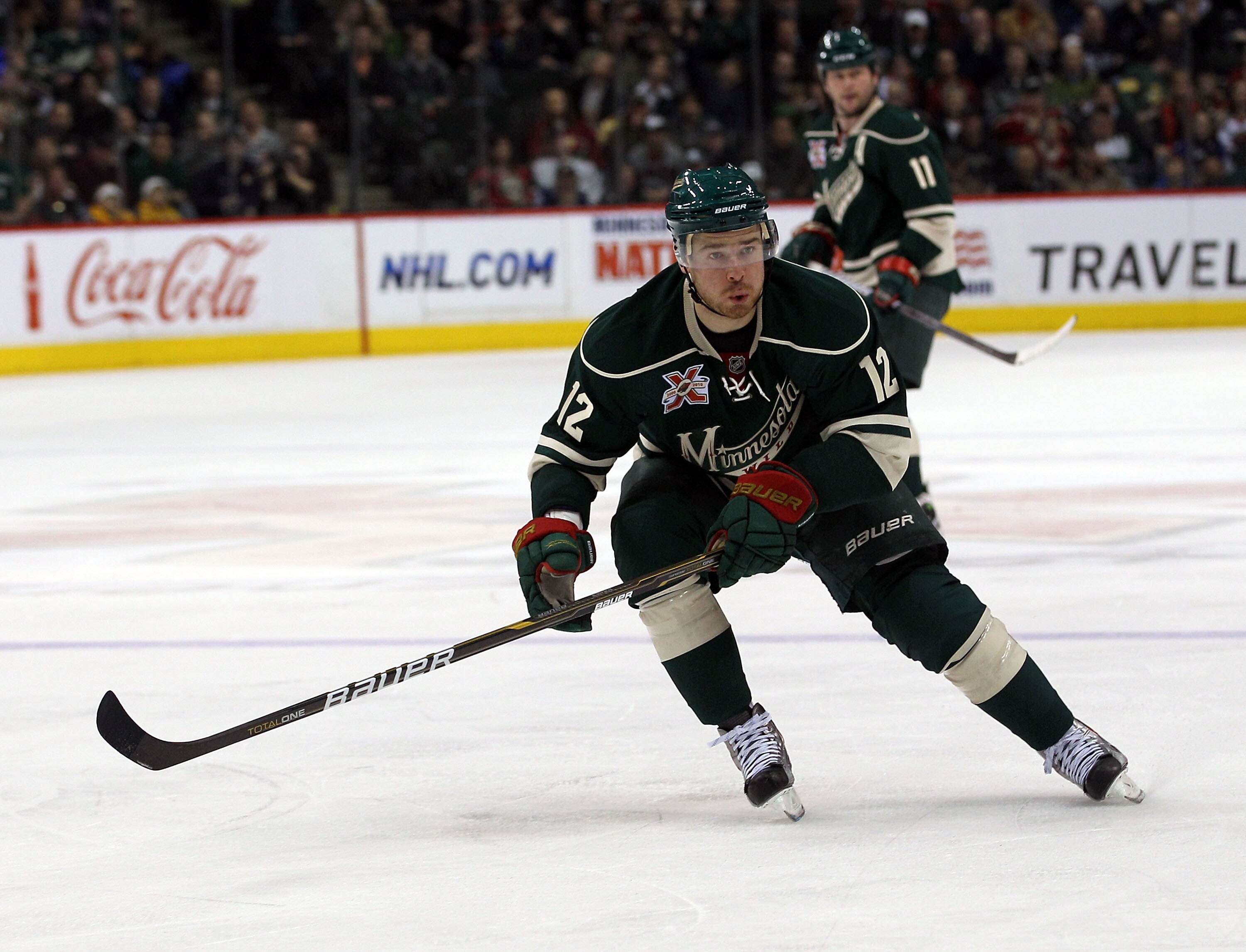 ST PAUL, MN - MARCH 22:  Chuck Kobasew #12 of the Minnesota Wild skates against the Toronto Maple Leafs at the Xcel Energy Center on March 22, 2011 in St Paul, Minnesota.  (Photo by Bruce Bennett/Getty Images)
