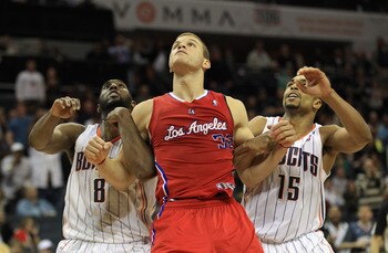 CHARLOTTE, NC - MARCH 07:  Blake Griffin #32 of the Los Angeles Clippers fights for position against DJ White #8 and teammate Gerald Henderson #15 of the Charlotte Bobcats during their game at Time Warner Cable Arena on March 7, 2011 in Charlotte, North C