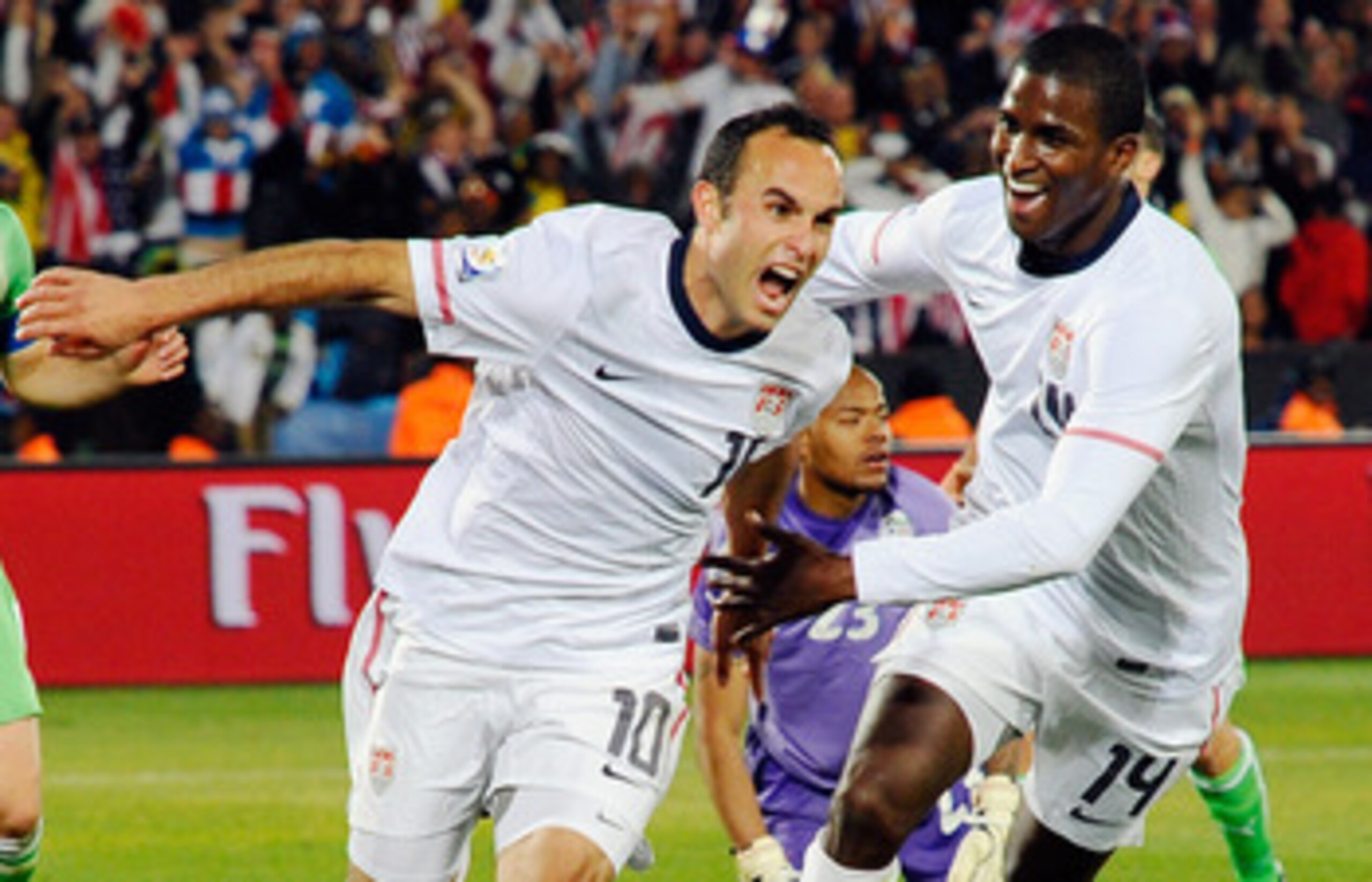 PRETORIA, SOUTH AFRICA - JUNE 23: Landon Donovan of the United States celebrates with teammate Edson Buddle after scoring the winning goal that sends the USA through to the second round during the 2010 FIFA World Cup South Africa Group C match between US PRETORIA, SOUTH AFRICA - JUNE 23: Landon Donovan of the United States celebrates with teammate Edson Buddle after scoring the winning goal that sends the USA through to the second round during the 2010 FIFA World Cup South Africa Group C match between US