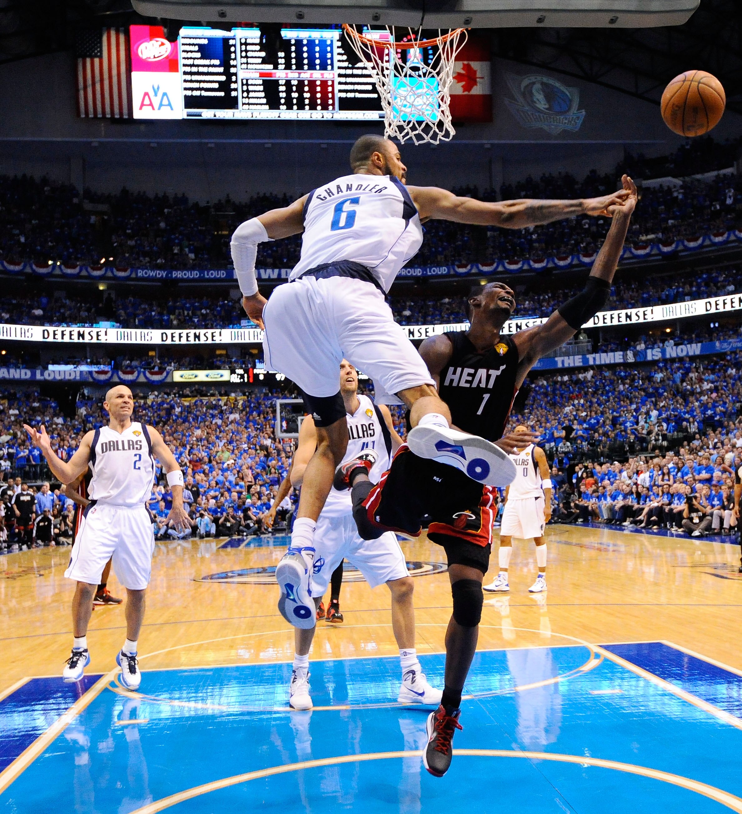 DALLAS, TX - JUNE 09:  Chris Bosh #1 of the Miami Heat drives for a shot attempt against Tyson Chandler #6 of the Dallas Mavericks in Game Five of the 2011 NBA Finals at American Airlines Center on June 9, 2011 in Dallas, Texas.  NOTE TO USER: User expres