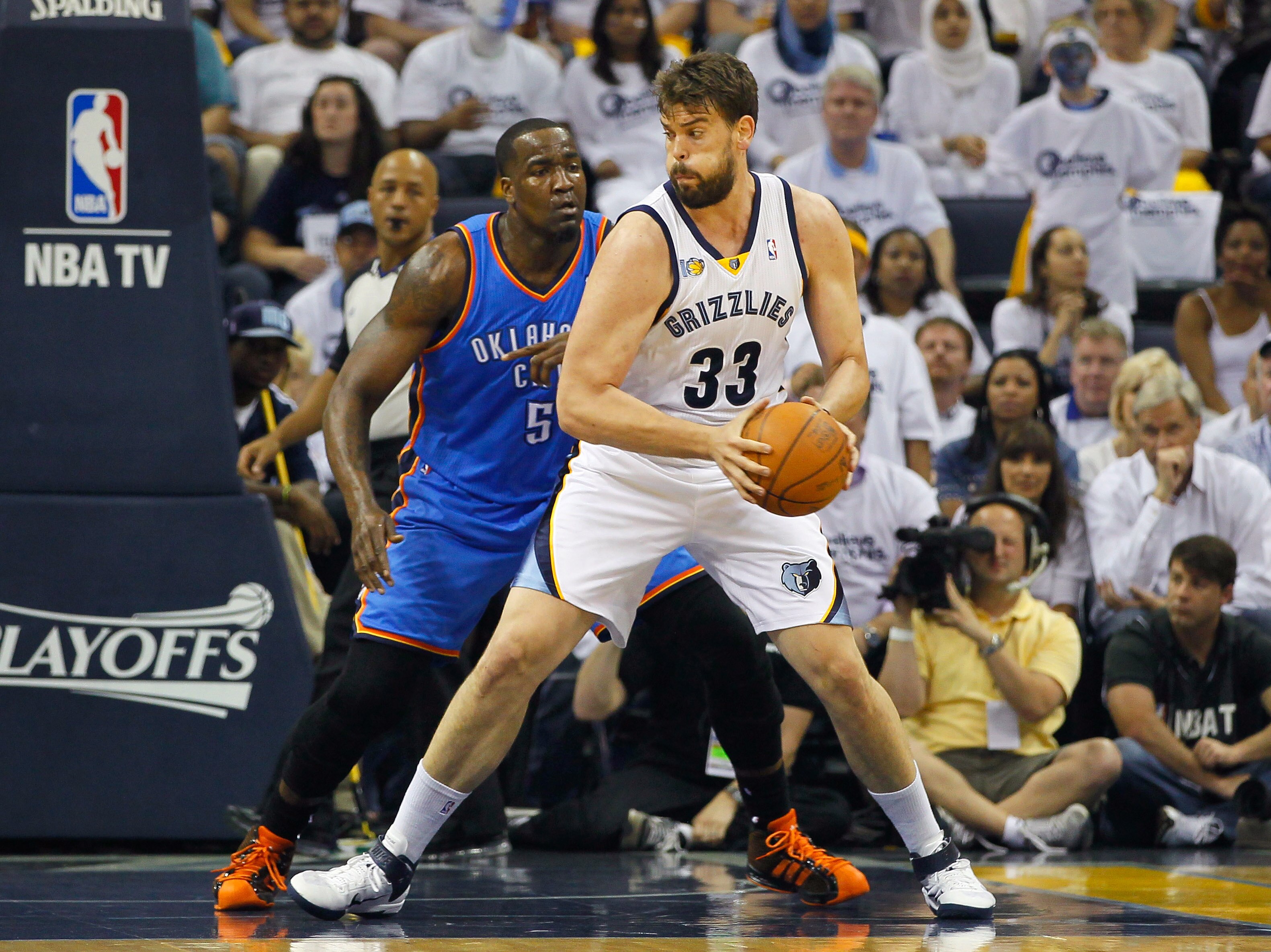 MEMPHIS, TN - MAY 13:  Marc Gasol #33 of the Memphis Grizzlies against Kendrick Perkins #5 of the Oklahoma City Thunder in Game Six of the Western Conference Semifinals in the 2011 NBA Playoffs at FedExForum on May 13, 2011 in Memphis, Tennessee.  NOTE TO