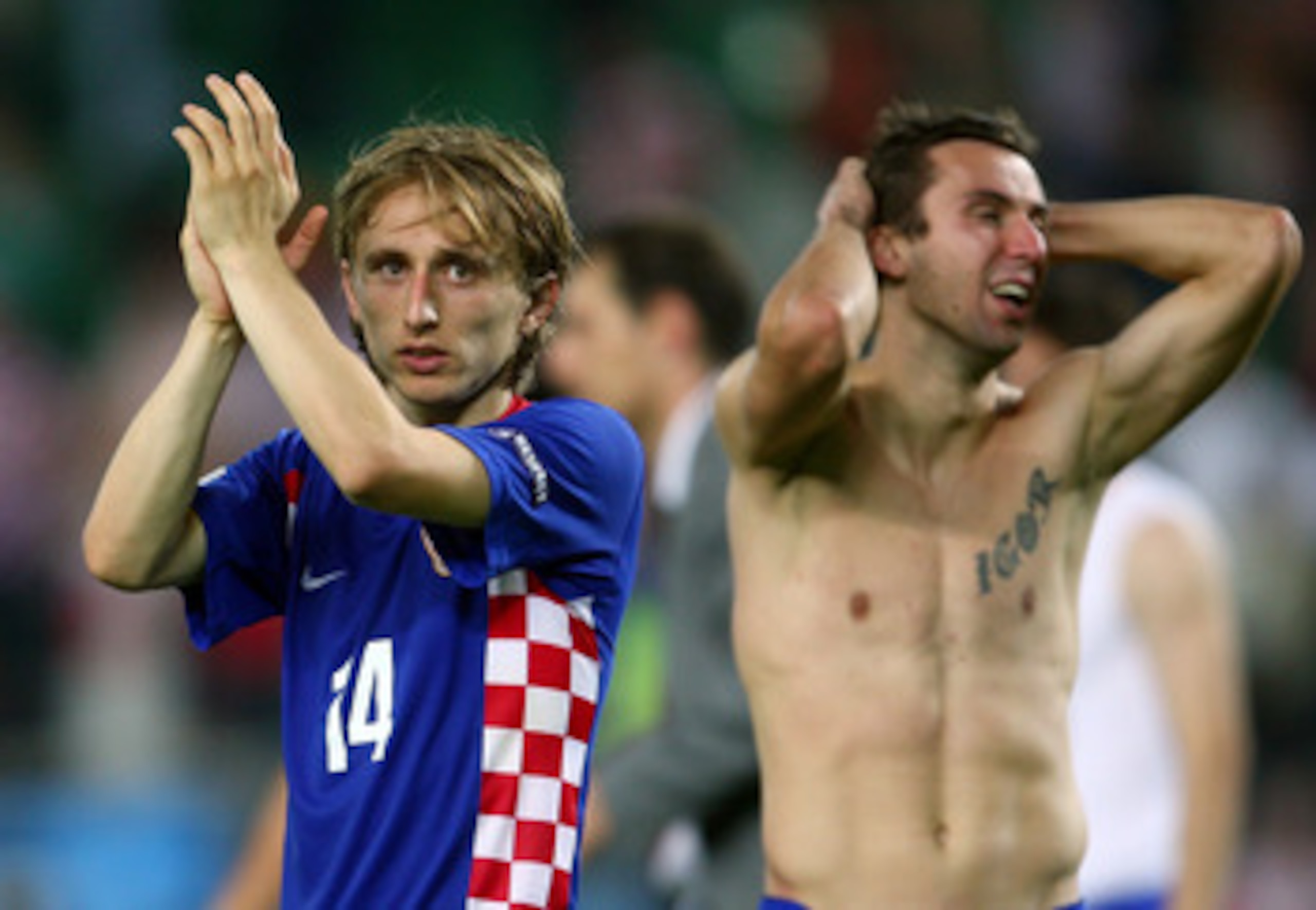 VIENNA, AUSTRIA - JUNE 20: Darijo Srna of Croatia holds his head as Luka Modric acknowledges the fans after defeat in the UEFA EURO 2008 Quarter Final match between Croatia and Turkey at Ernst Happel Stadion on June 20, 2008 in Vienna, Austria. (Photo b VIENNA, AUSTRIA - JUNE 20: Darijo Srna of Croatia holds his head as Luka Modric acknowledges the fans after defeat in the UEFA EURO 2008 Quarter Final match between Croatia and Turkey at Ernst Happel Stadion on June 20, 2008 in Vienna, Austria. (Photo b
