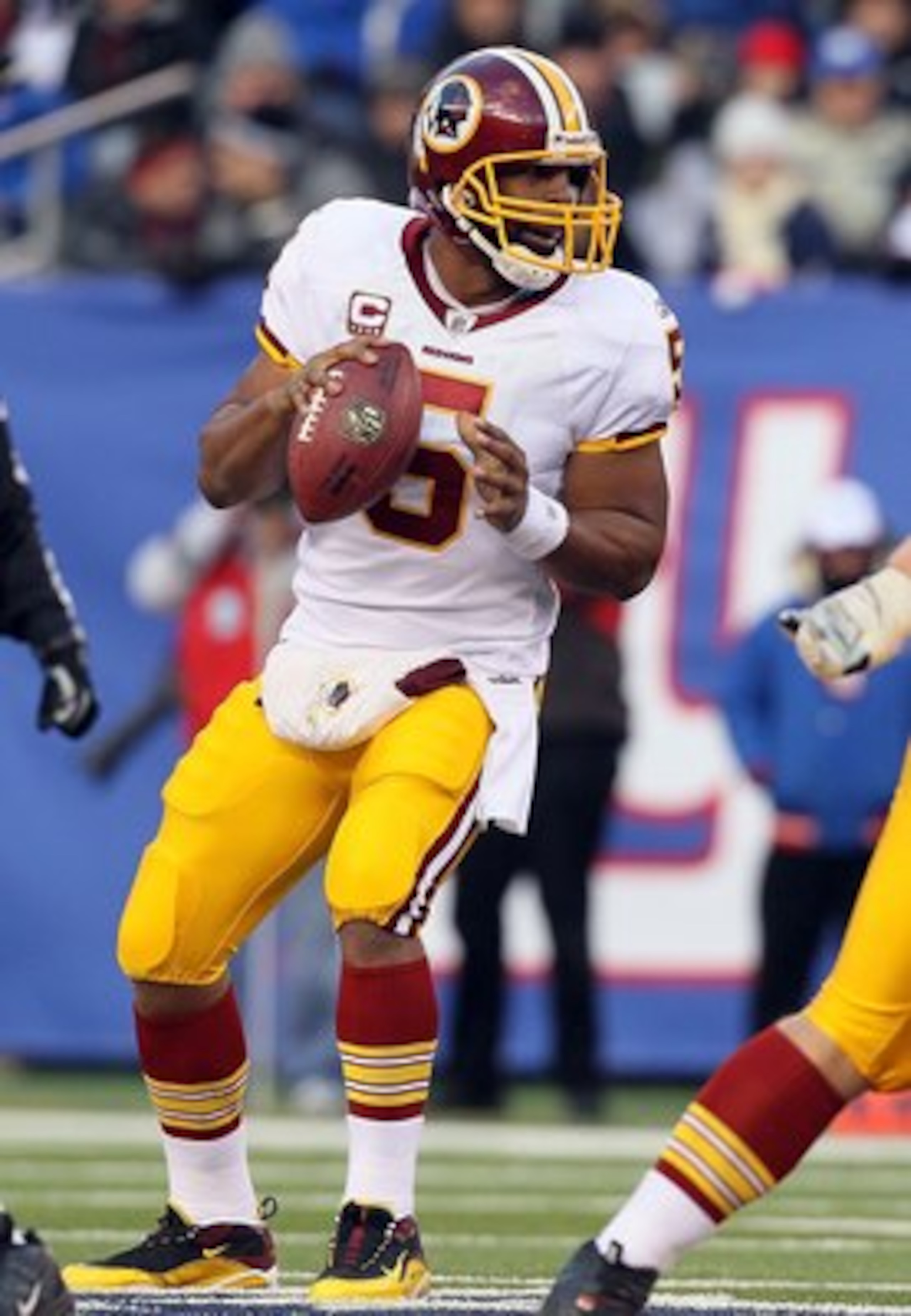 EAST RUTHERFORD, NJ - DECEMBER 05:  Donovan McNabb #5 of the Washington Redskins looks to throw a pass against the New York Giants on December 5, 2010 at the New Meadowlands Stadium in East Rutherford, New Jersey. The Giants defeated the Redskins 31-7.  (