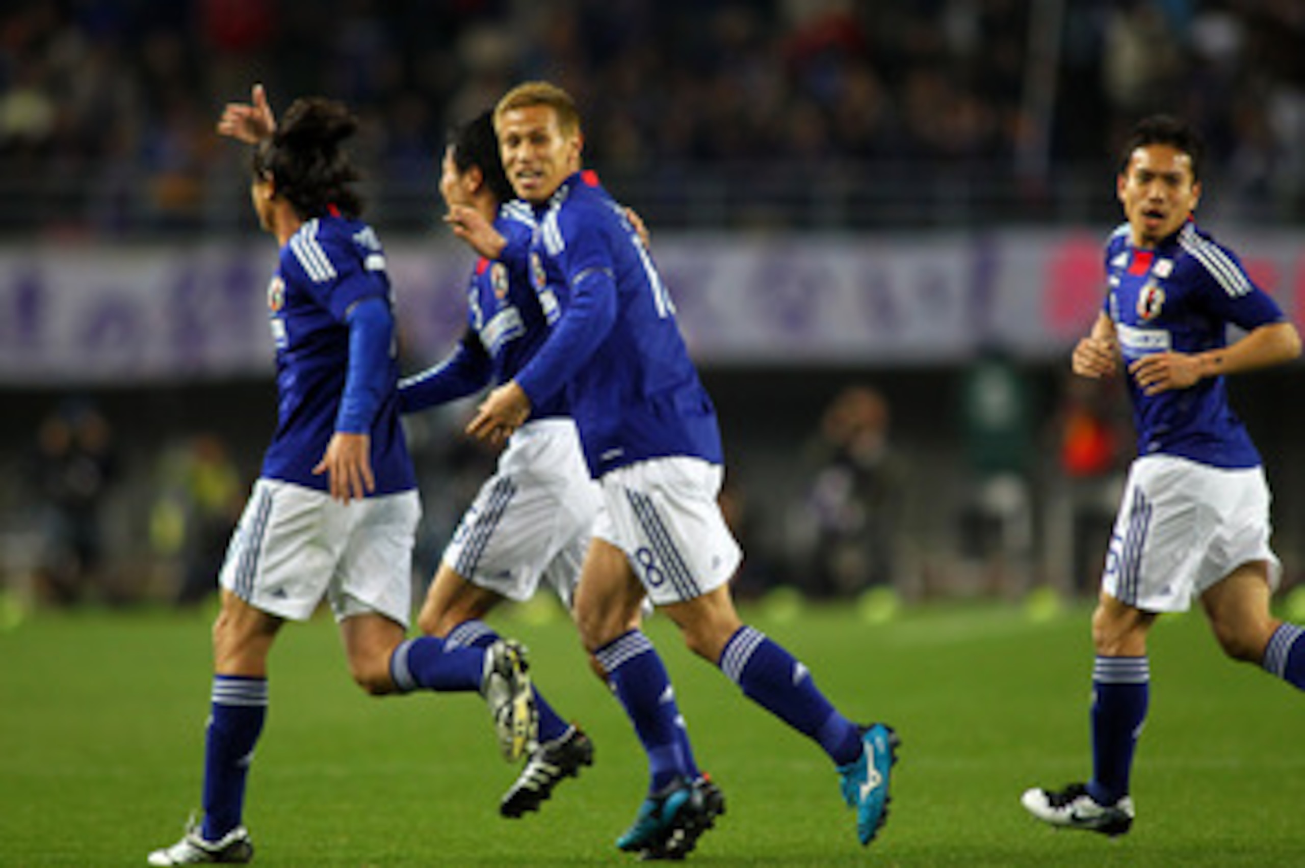 OSAKA, JAPAN - MARCH 29: Yasuhito Endo (L) of Japan celebrates after scoring the first goal with Keisuke Honda and Yuto Nagatomo during a charity match for those affected by the earthquake and tsunami at Nagai Stadium on March 29, 2011 in Osaka, Japan. (P OSAKA, JAPAN - MARCH 29: Yasuhito Endo (L) of Japan celebrates after scoring the first goal with Keisuke Honda and Yuto Nagatomo during a charity match for those affected by the earthquake and tsunami at Nagai Stadium on March 29, 2011 in Osaka, Japan. (P
