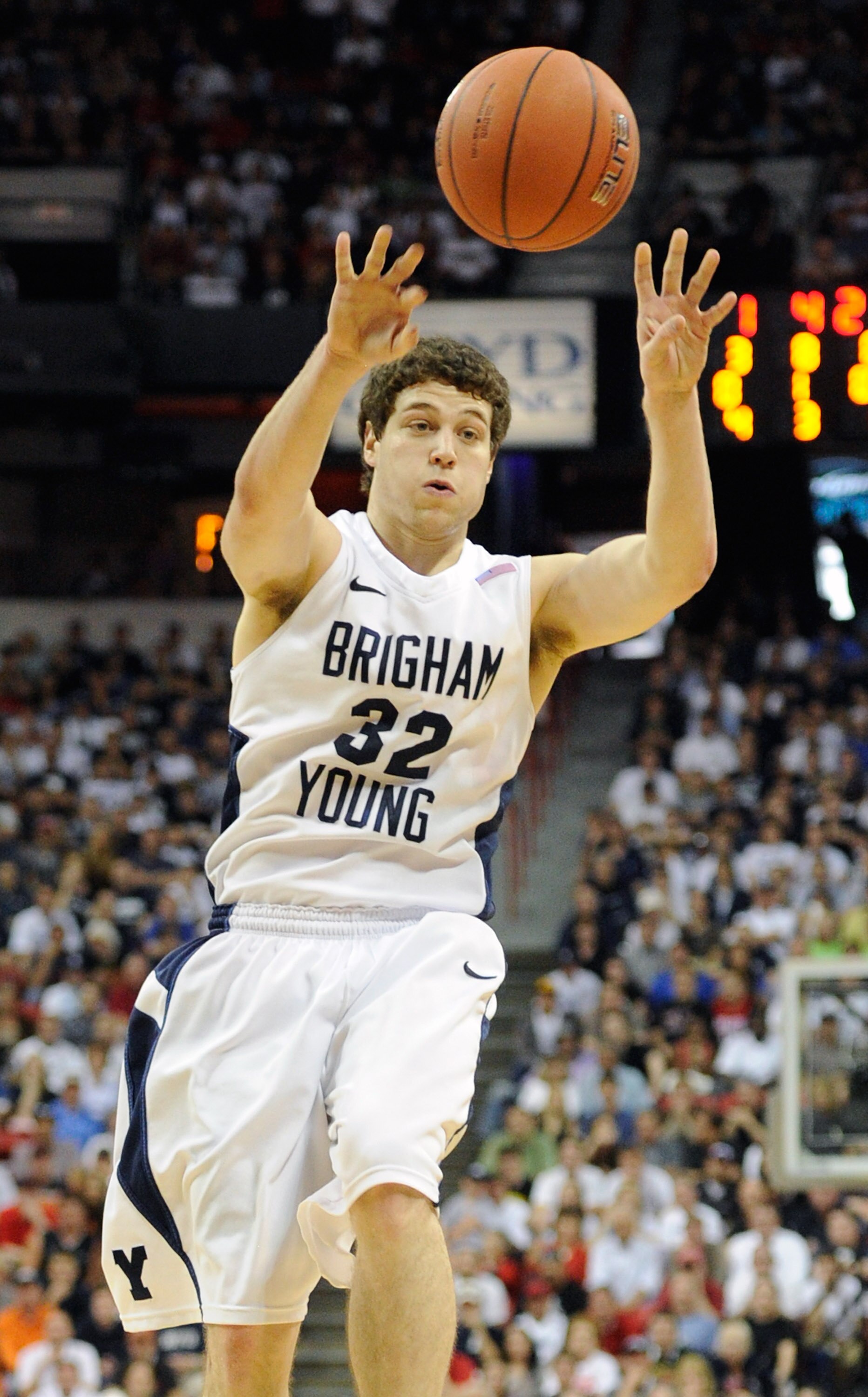 LAS VEGAS, NV - MARCH 12:  Jimmer Fredette #32 of the Brigham Young University Cougars passes the ball during the championship game of the Conoco Mountain West Conference Basketball tournament against the San Diego State Aztecs at the Thomas & Mack Center