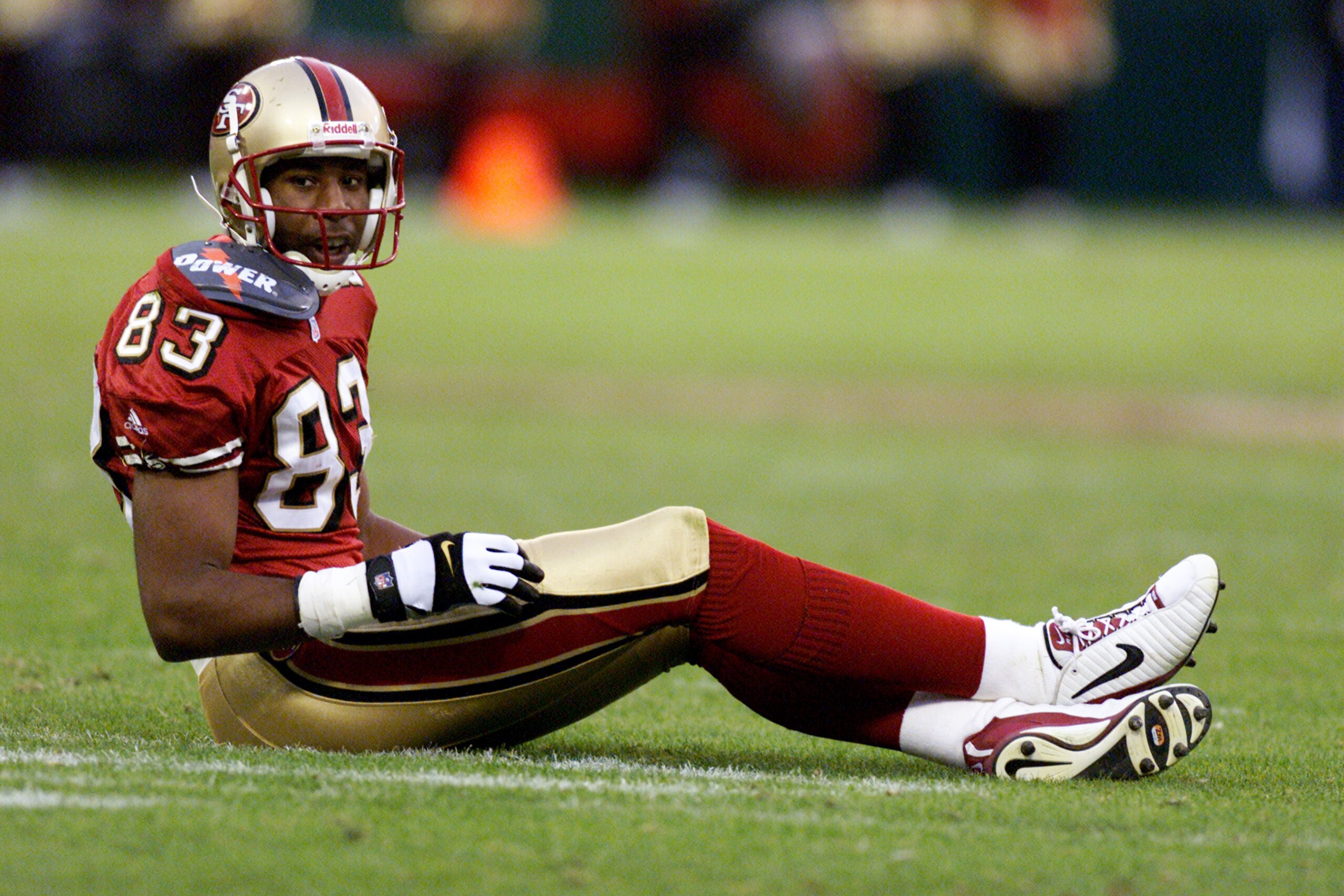 11 Nov 2001:  J.J. Stokes #83 of the San Fransisco 49ers falls during the game agains the New Orleans Saints at 3 Com Stadium in San Fransisco, California. DIGITAL IMAGE  Mandatory Credit: Donald Miralle/ALLSPORT