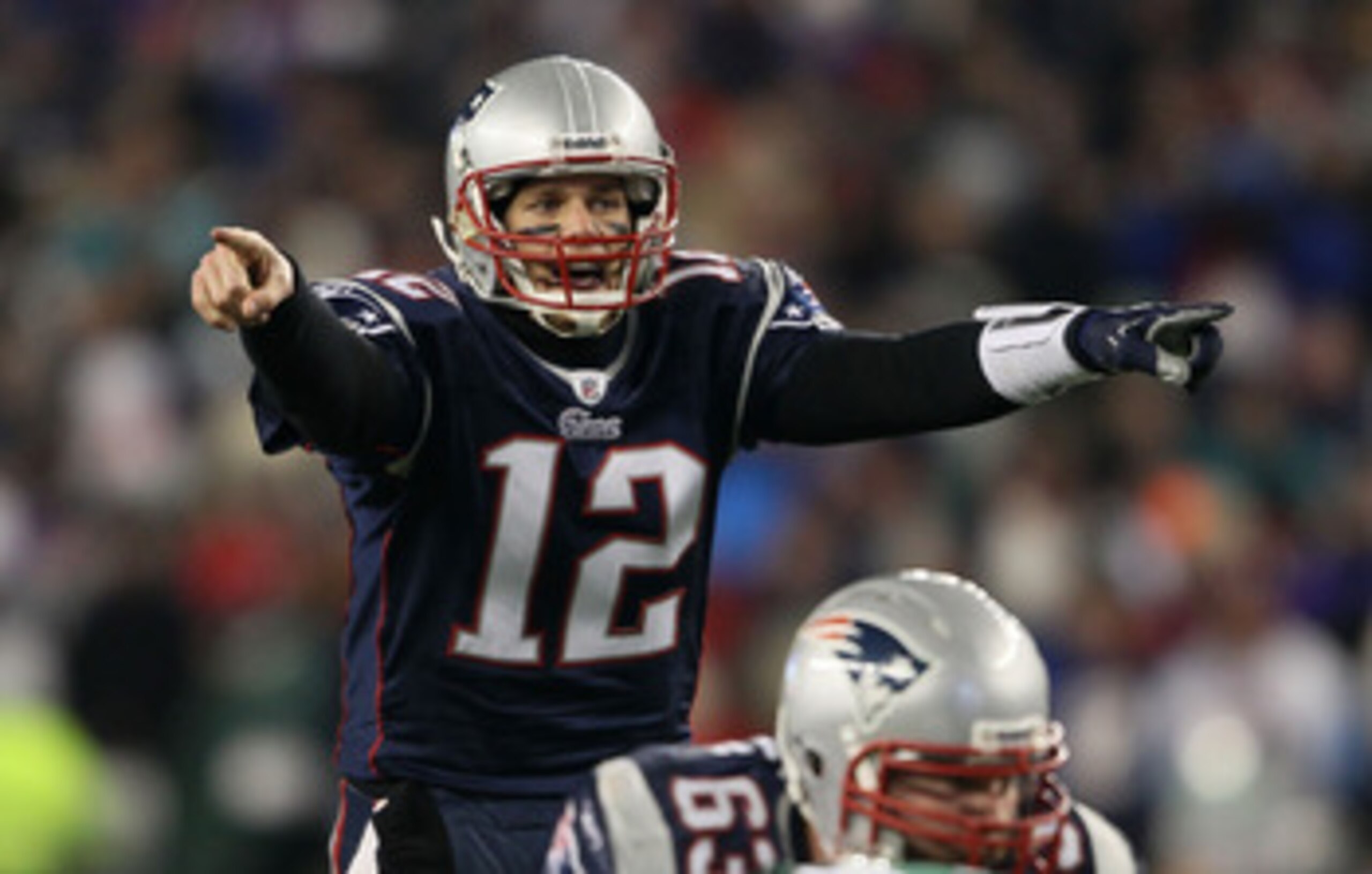FOXBORO, MA - JANUARY 16:  Quarterback Tom Brady #12 of the New England Patriots signals during their 2011 AFC divisional playoff game against the New York Jets at Gillette Stadium on January 16, 2011 in Foxboro, Massachusetts.  (Photo by Elsa/Getty Image