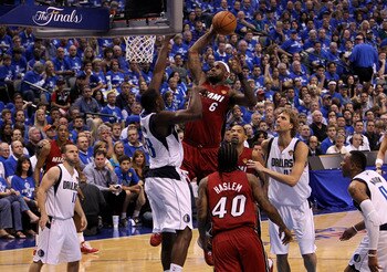 DALLAS, TX - JUNE 05:  LeBron James #6 of the Miami Heat attempts a dunk in the first half against Ian Mahinmi #28 of the Dallas Mavericks in Game Three of the 2011 NBA Finals at American Airlines Center on June 5, 2011 in Dallas, Texas.  NOTE TO USER: Us