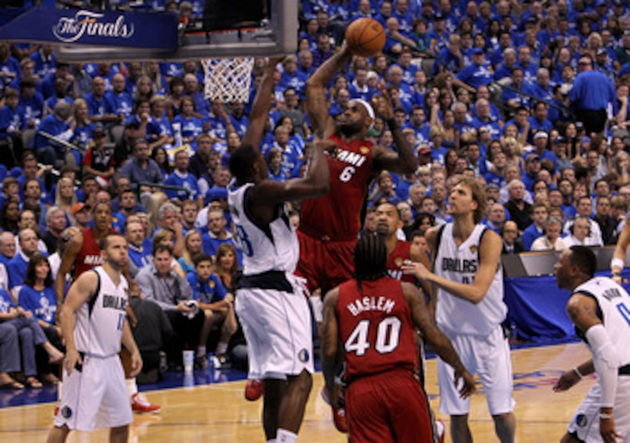 DALLAS, TX - JUNE 05:  LeBron James #6 of the Miami Heat attempts a dunk in the first half against Ian Mahinmi #28 of the Dallas Mavericks in Game Three of the 2011 NBA Finals at American Airlines Center on June 5, 2011 in Dallas, Texas.  NOTE TO USER: Us