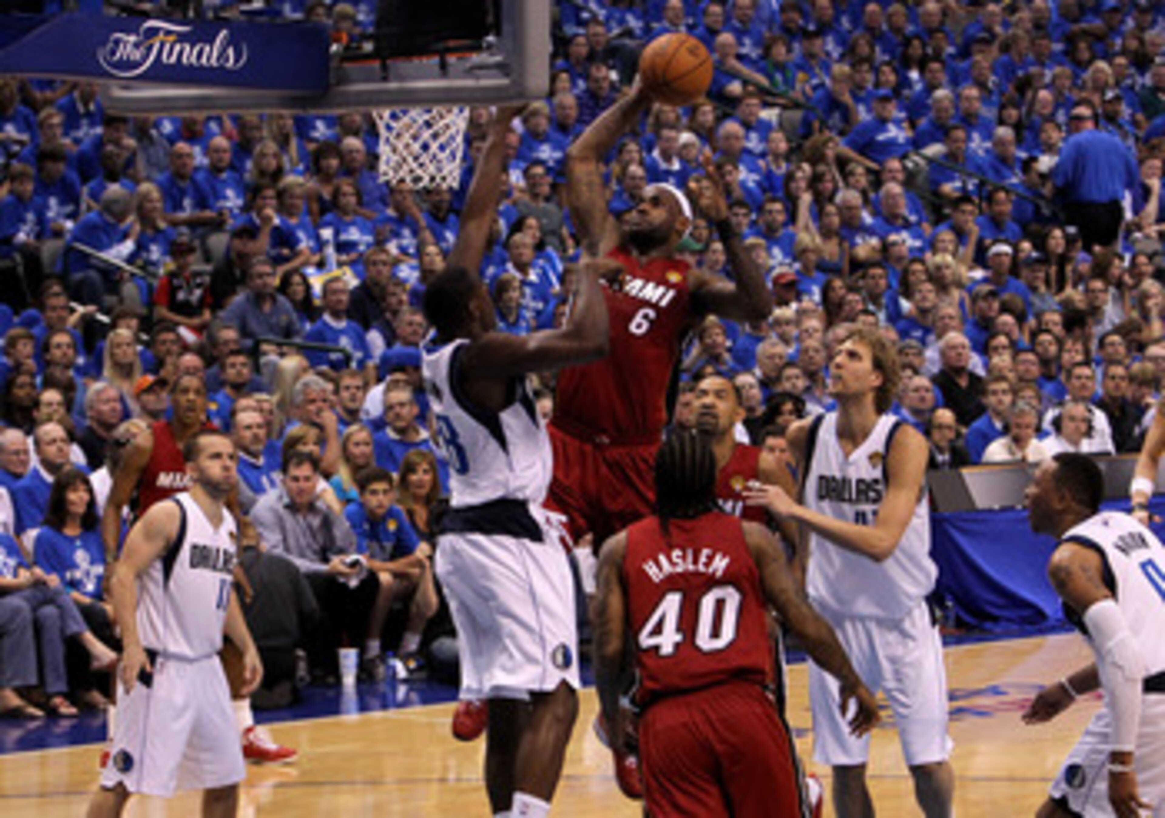 DALLAS, TX - JUNE 05:  LeBron James #6 of the Miami Heat attempts a dunk in the first half against Ian Mahinmi #28 of the Dallas Mavericks in Game Three of the 2011 NBA Finals at American Airlines Center on June 5, 2011 in Dallas, Texas.  NOTE TO USER: Us