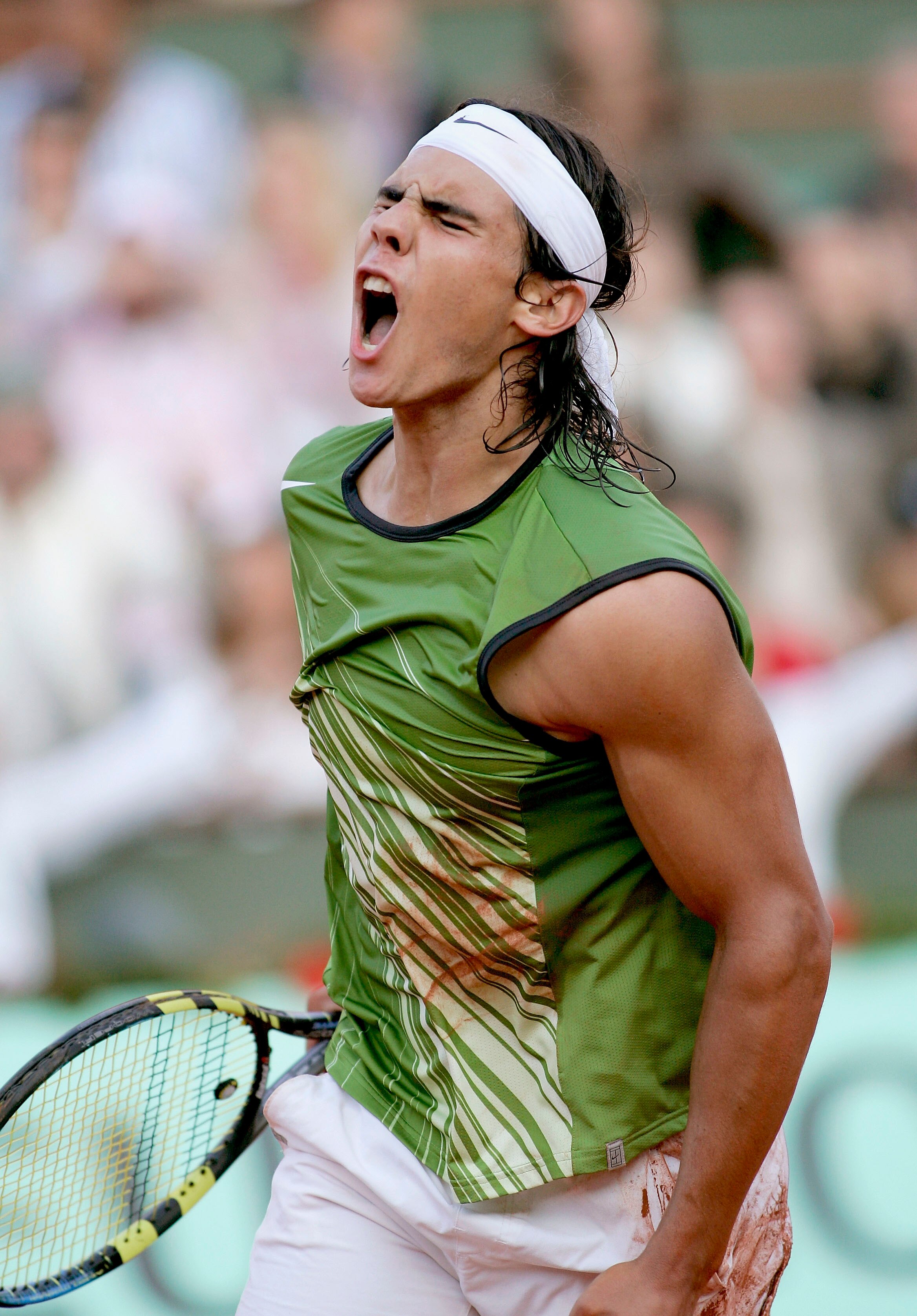 PARIS - JUNE 03:  Rafael Nadal of Spain celebrates match point as he defeats Roger Federer of Switzerland in four sets during his semi-final match on the twelfth day of the French Open at Roland Garros on June 3, 2005 in Paris, France.  (Photo by Michael