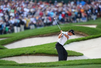 BLOOMFIELD HILLS, MI - AUGUST 10:  Padraig Harrington of Ireland plays from a bunker in the fairway of the 18th hole during the final round of the 90th PGA Championship at Oakland Hills Country Club on August 10, 2008 in Bloomfield Township, Michigan.  (P