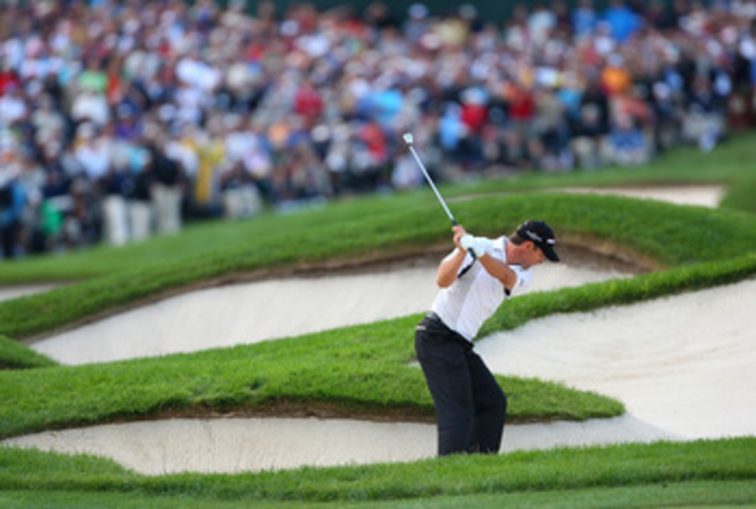 BLOOMFIELD HILLS, MI - AUGUST 10:  Padraig Harrington of Ireland plays from a bunker in the fairway of the 18th hole during the final round of the 90th PGA Championship at Oakland Hills Country Club on August 10, 2008 in Bloomfield Township, Michigan.  (P
