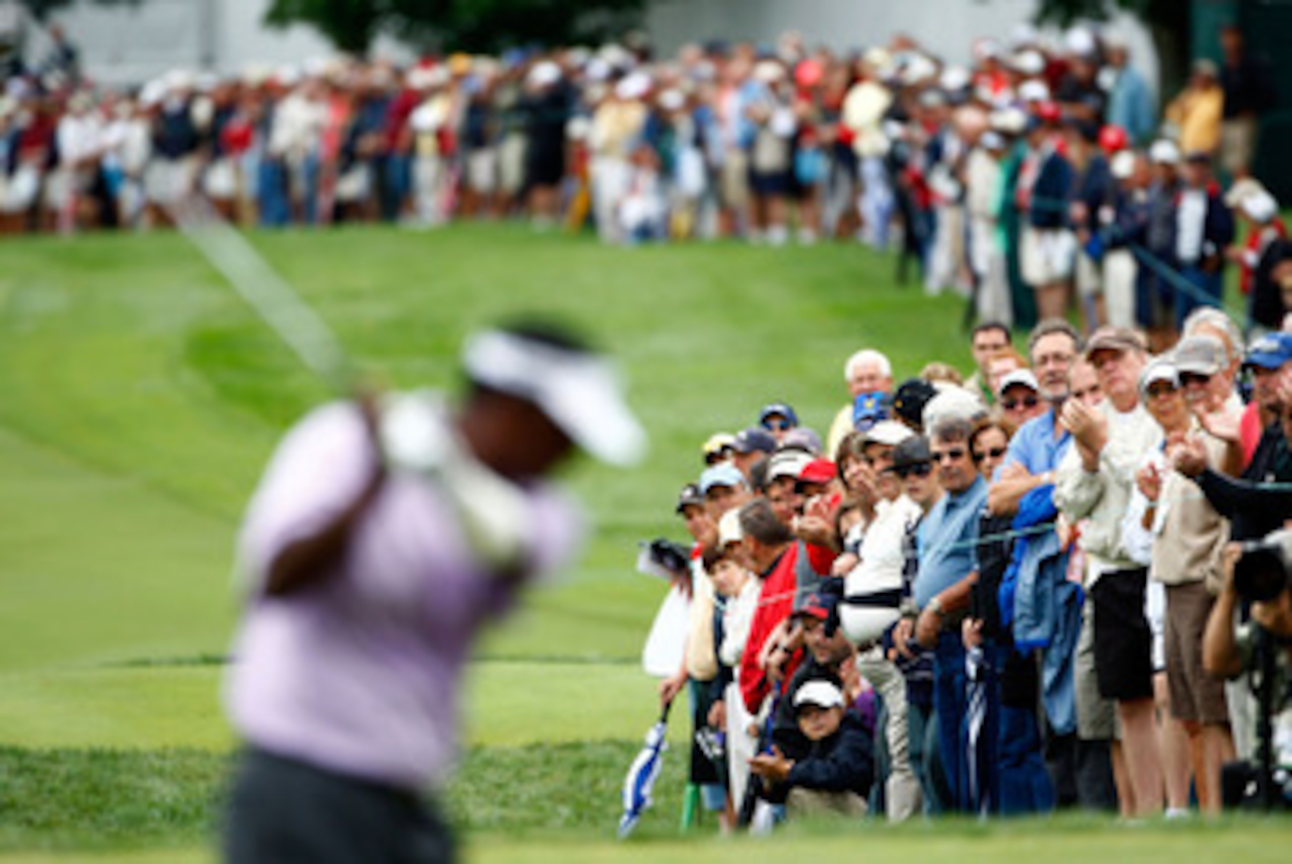 ST. LOUIS - SEPTEMBER 05:  The gallery watches Vijay Singh of Fiji on the 10th hole during the weather-delayed first round of the BMW Championship on September 5, 2008 at Bellerive Country Club in St. Louis, Missouri.  (Photo by Jamie Squire/Getty Images)