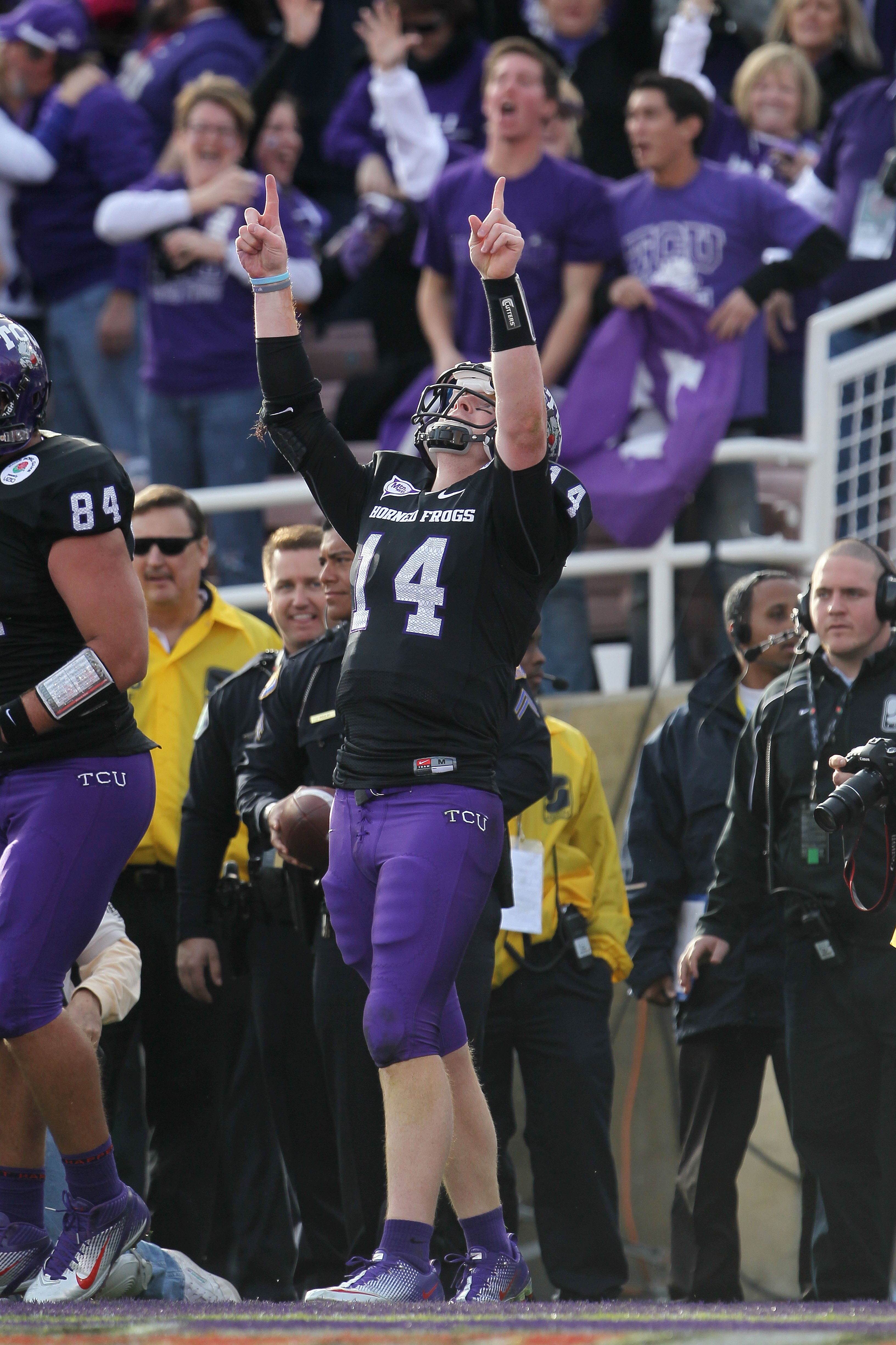 PASADENA, CA - JANUARY 01:  Quarterback Andy Dalton #14 of the TCU Horned Frogs celebrates after a touchdown against the Wisconsin Badgers in the first quarter of the 97th Rose Bowl game on January 1, 2011 in Pasadena, California.  (Photo by Jeff Gross/Ge