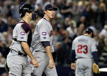 NEW YORK - OCTOBER 09:  Joe Mauer #7 talks with Joe Nathan #36 of the Minnesota Twins after an erron in the tenth inning against the New York Yankees in Game Two of the ALDS during the 2009 MLB Playoffs at Yankee Stadium on October 9, 2009 in the Bronx bo