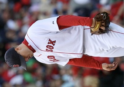 BOSTON - OCTOBER 11:  Pitcher Jonathan Papelbon #58 of the Boston Red Sox reacts after allowing three runs in the ninth inning to blow the save against the Los Angeles Angels of Anaheim in Game Three of the ALDS during the 2009 MLB Playoffs at Fenway Park
