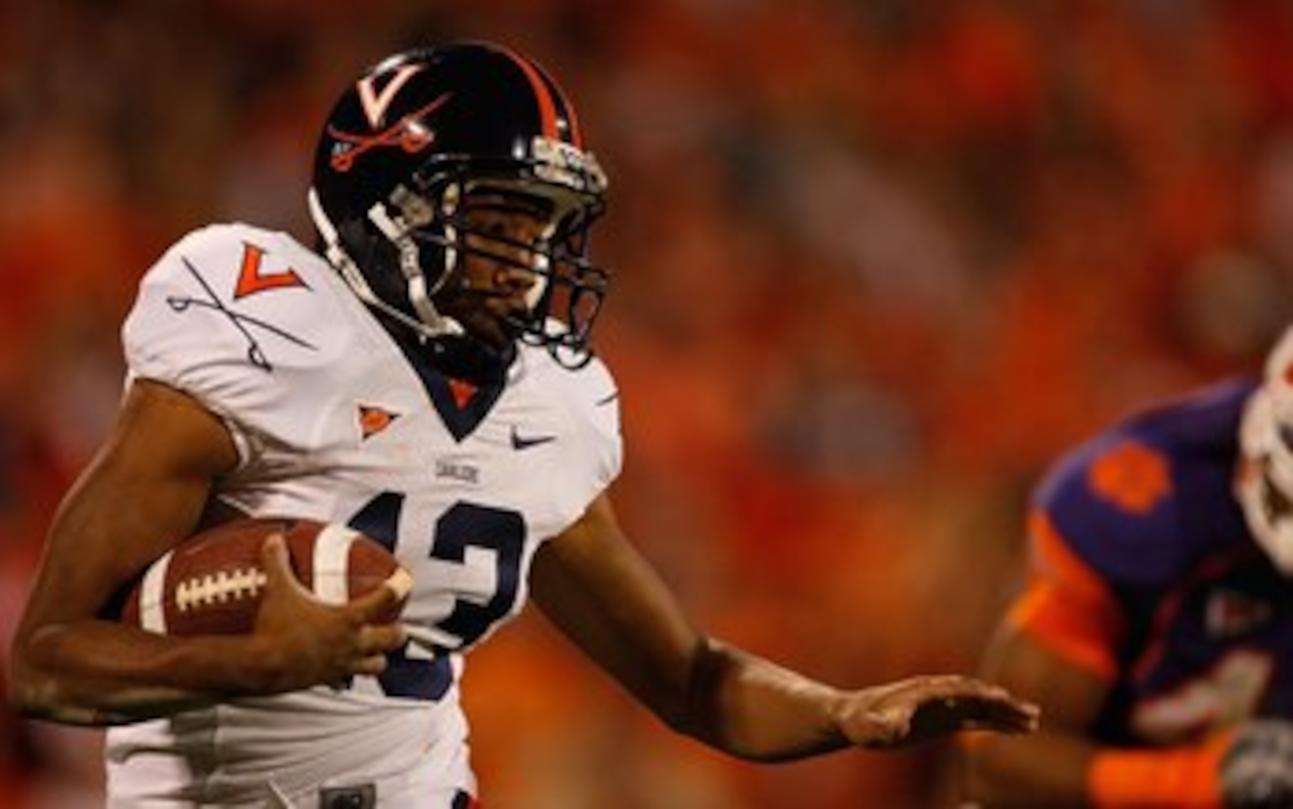 CLEMSON, SC - NOVEMBER 21:  Chase Minnifield #13 of the Virginia Cavaliers runs with the ball during the game against the Clemson Tigers at Memorial Stadium on November 21, 2009 in Clemson, South Carolina.  (Photo by Streeter Lecka/Getty Images)