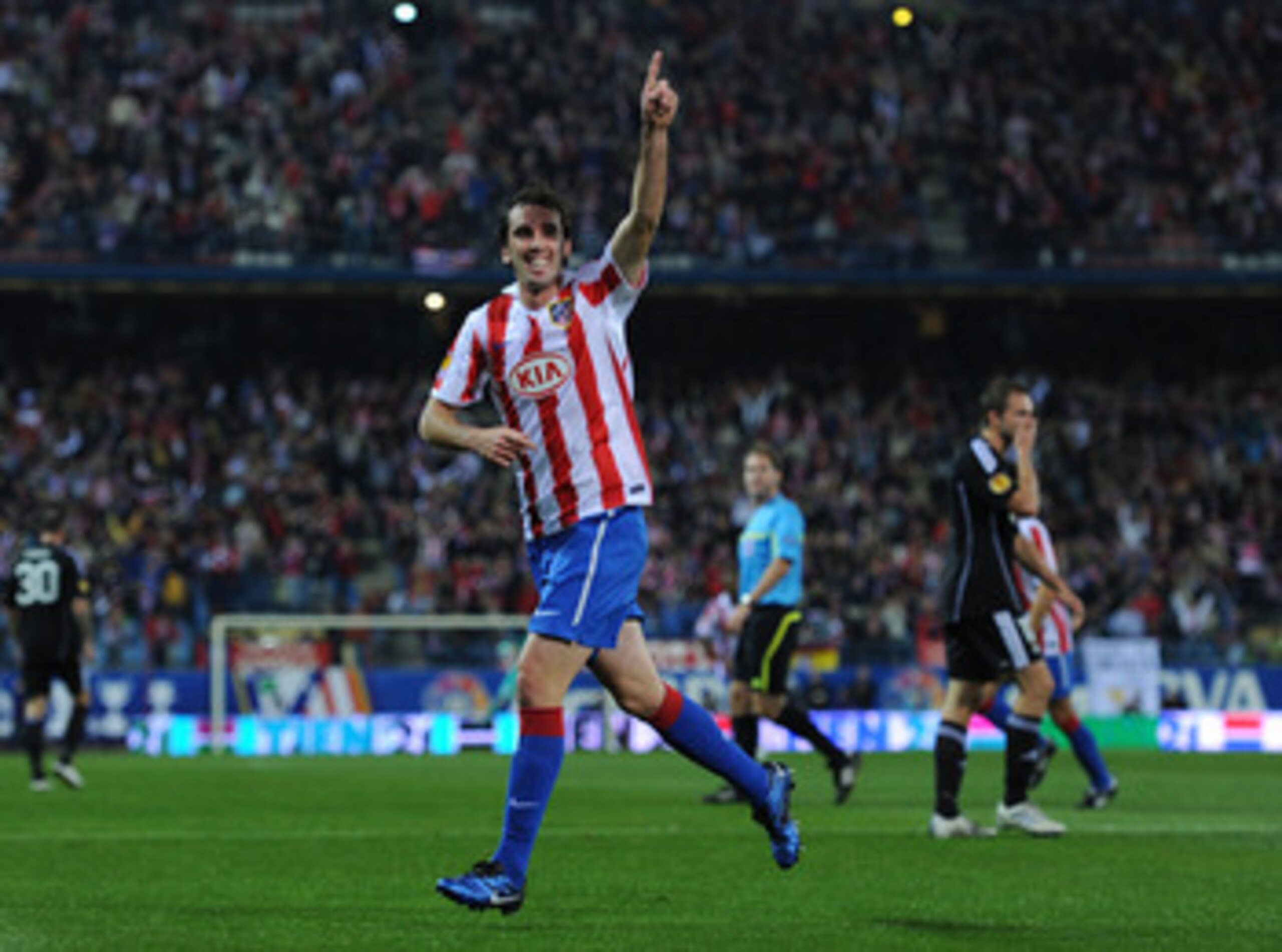 MADRID, SPAIN - OCTOBER 21:  Diego Godin of Atletico Madrid celebrates scoring his sides opening goal during the UEFA Europa League group B match between Atletico Madrid and Rosenborg at the Vicente Calderon Stadium on October 21, 2010 in Madrid, Spain.
