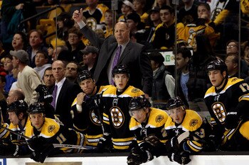 BOSTON - OCTOBER 23:  Head coach Claude Julien of the Boston Bruins gestures from behind the bench against the New York Rangers at the TD Garden on October 23, 2010 in Boston, Massachusetts.  The Rangers won 3-2.  (Photo by Bruce Bennett/Getty Images)