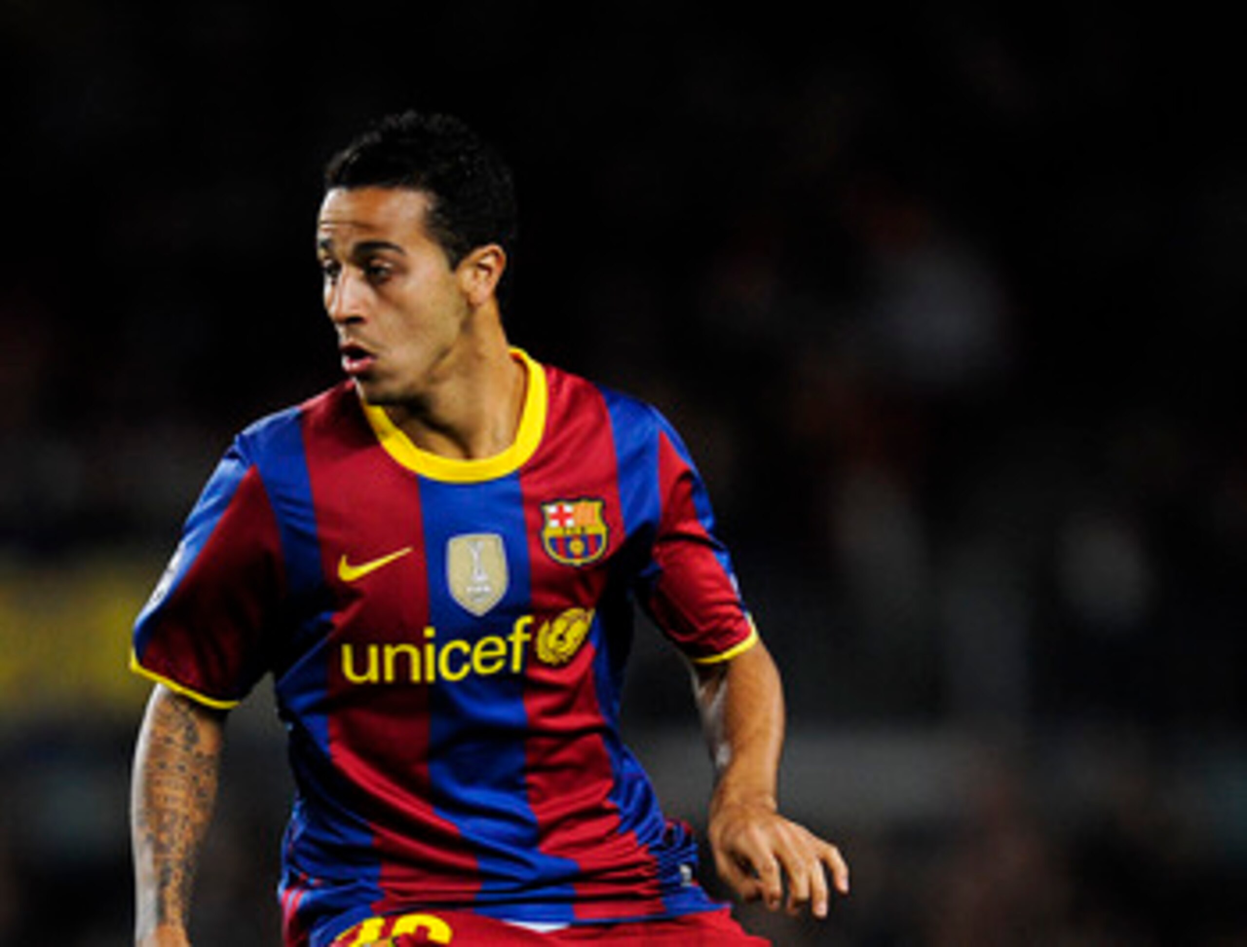 BARCELONA, SPAIN - DECEMBER 07:  Thiago Alcantara of Barcelona runs with the ball during the Champions League match between Barcelona and Rubin Kazan at Camp Nou Stadium on December 7, 2010 in Barcelona, Spain. Barcelona won 2-0.  (Photo by David Ramos/Ge