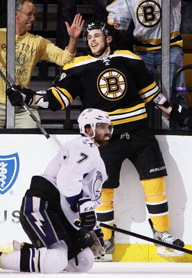 BOSTON, MA - MAY 17:  Tyler Seguin #19 of the Boston Bruins celebrates scoring a goal as Brett Clark #7 of the Tampa Bay Lightning looks on in Game Two of the Eastern Conference Finals during the 2011 NHL Stanley Cup Playoffs at TD Garden on May 17, 2011 