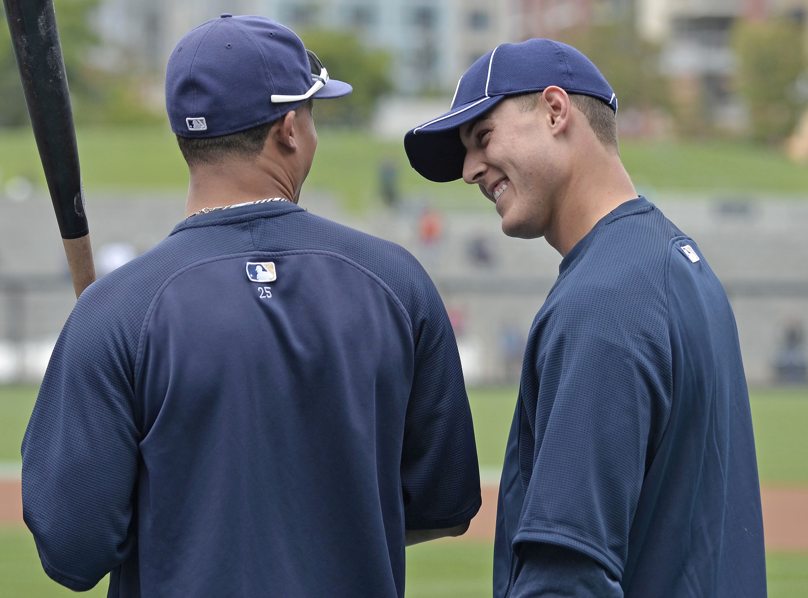 SAN DIEGO, CA - JUNE 9: Anthony Rizzo #27 of the San Diego Padres (R),  talks with teammate Will Venable, left, during batting practice before a baseball game against the Washington Nationals at Petco Park on June 9, 2011 in San Diego, California.  (Photo